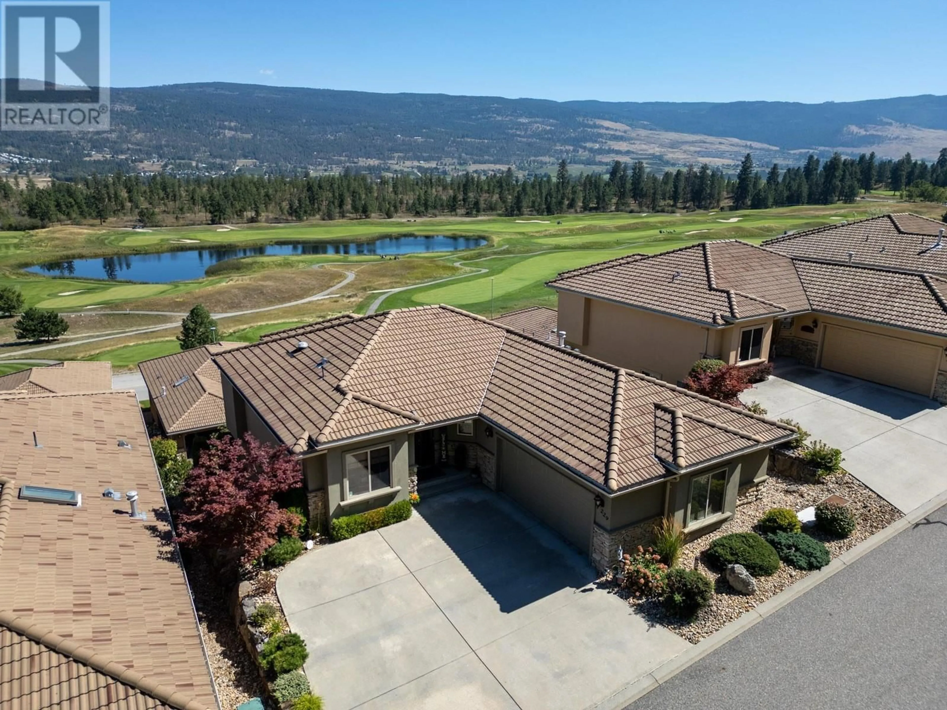 A pic from outside/outdoor area/front of a property/back of a property/a pic from drone, unknown for 2455 Quail Ridge Boulevard Unit# 229, Kelowna British Columbia V1V2S8