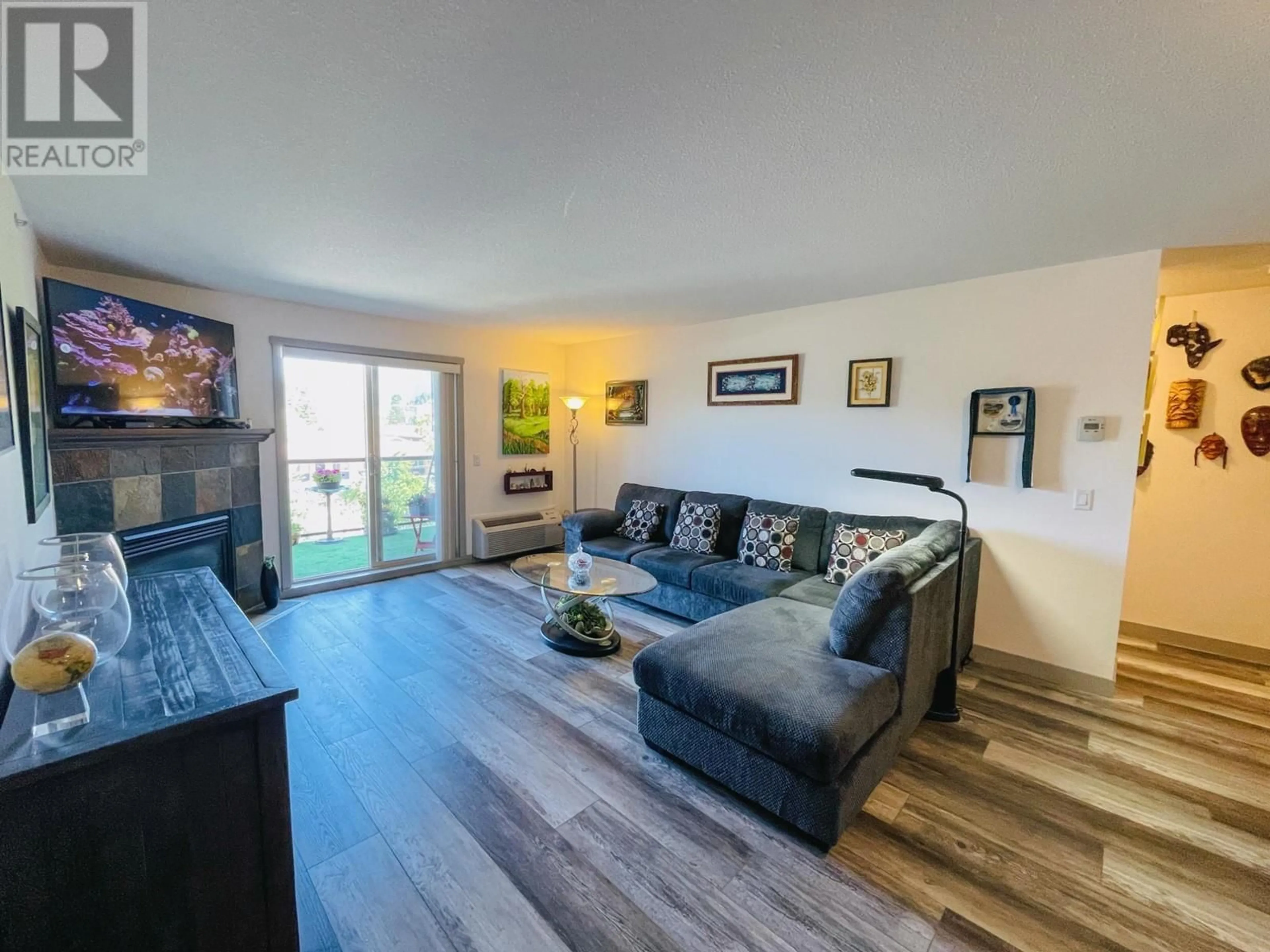 Living room with furniture, wood/laminate floor for 4874 STANLEY Street Unit# 405, Radium Hot Springs British Columbia V0A1M0