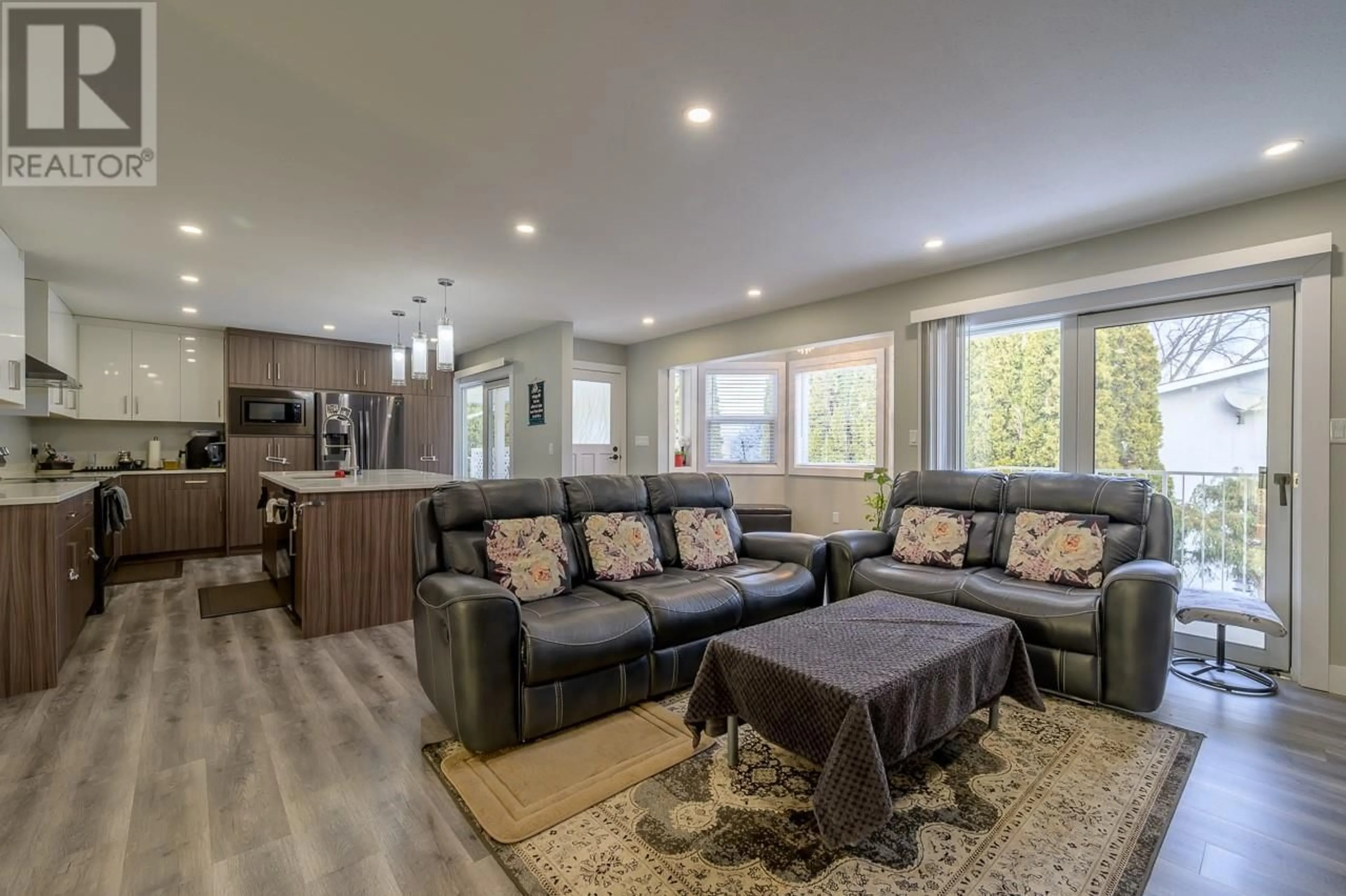 Living room with furniture, wood/laminate floor for 131 FORT AVENUE, Kamloops British Columbia V2B1G9