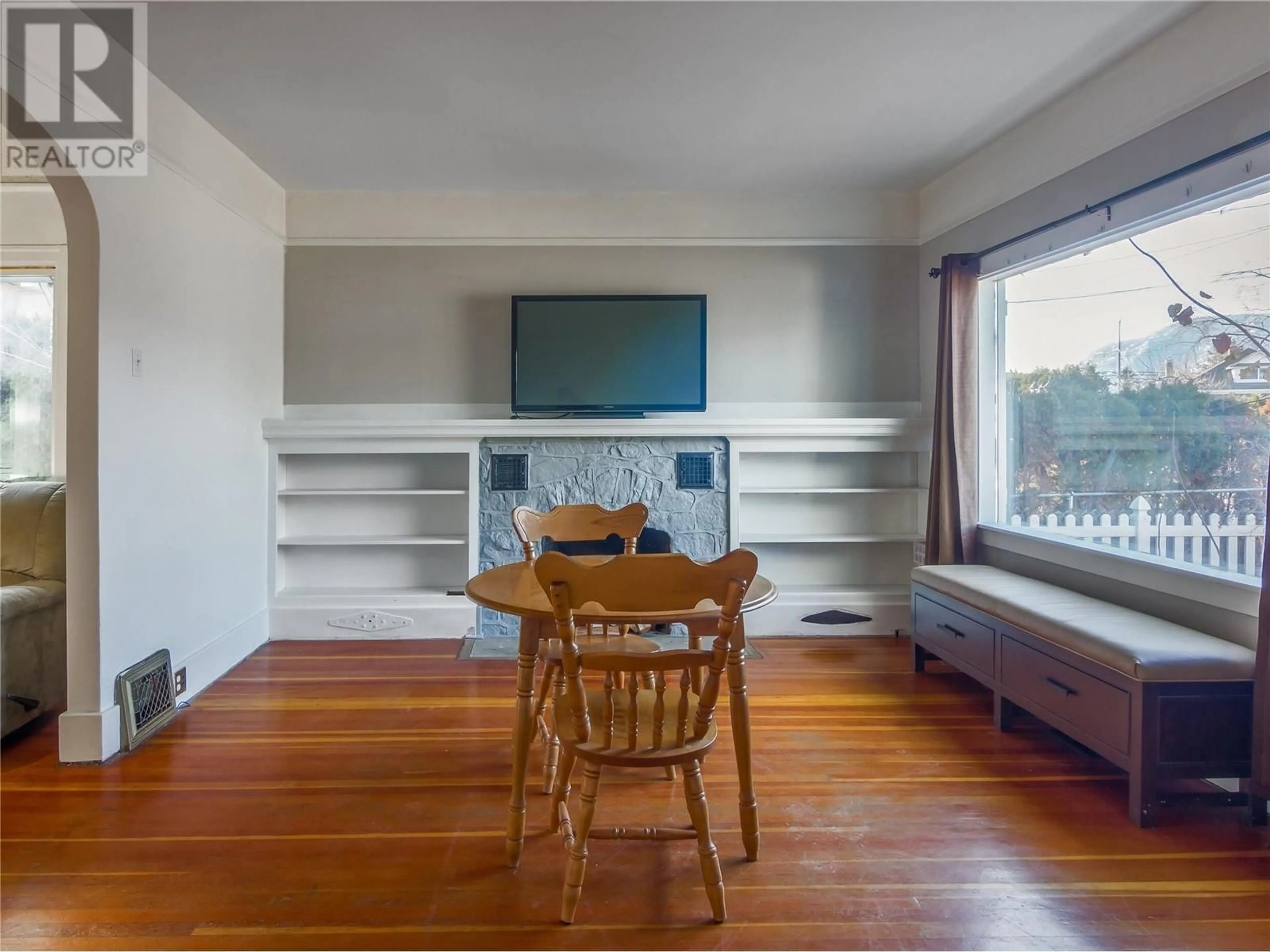 Living room with furniture, wood/laminate floor for 678 Latimer Street, Penticton British Columbia V2A5R6