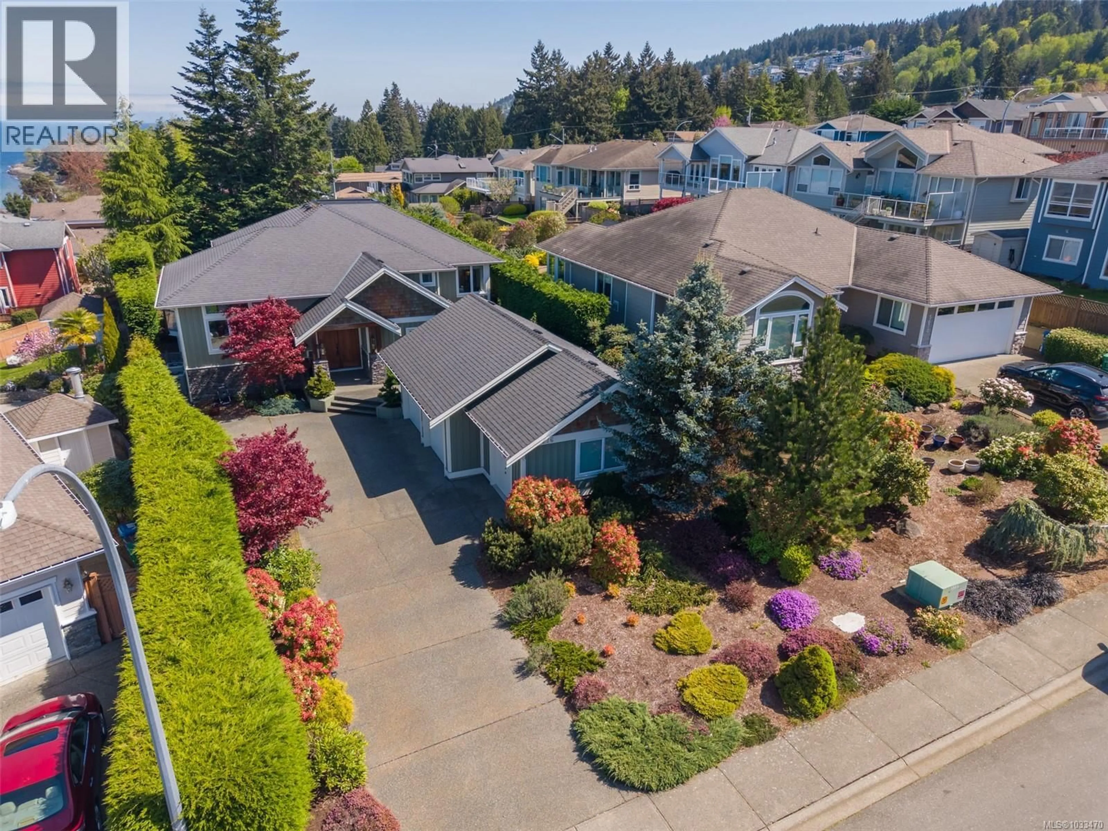 A pic from outside/outdoor area/front of a property/back of a property/a pic from drone, street for 5676 MUGGIES WAY, Nanaimo British Columbia V9V1W2