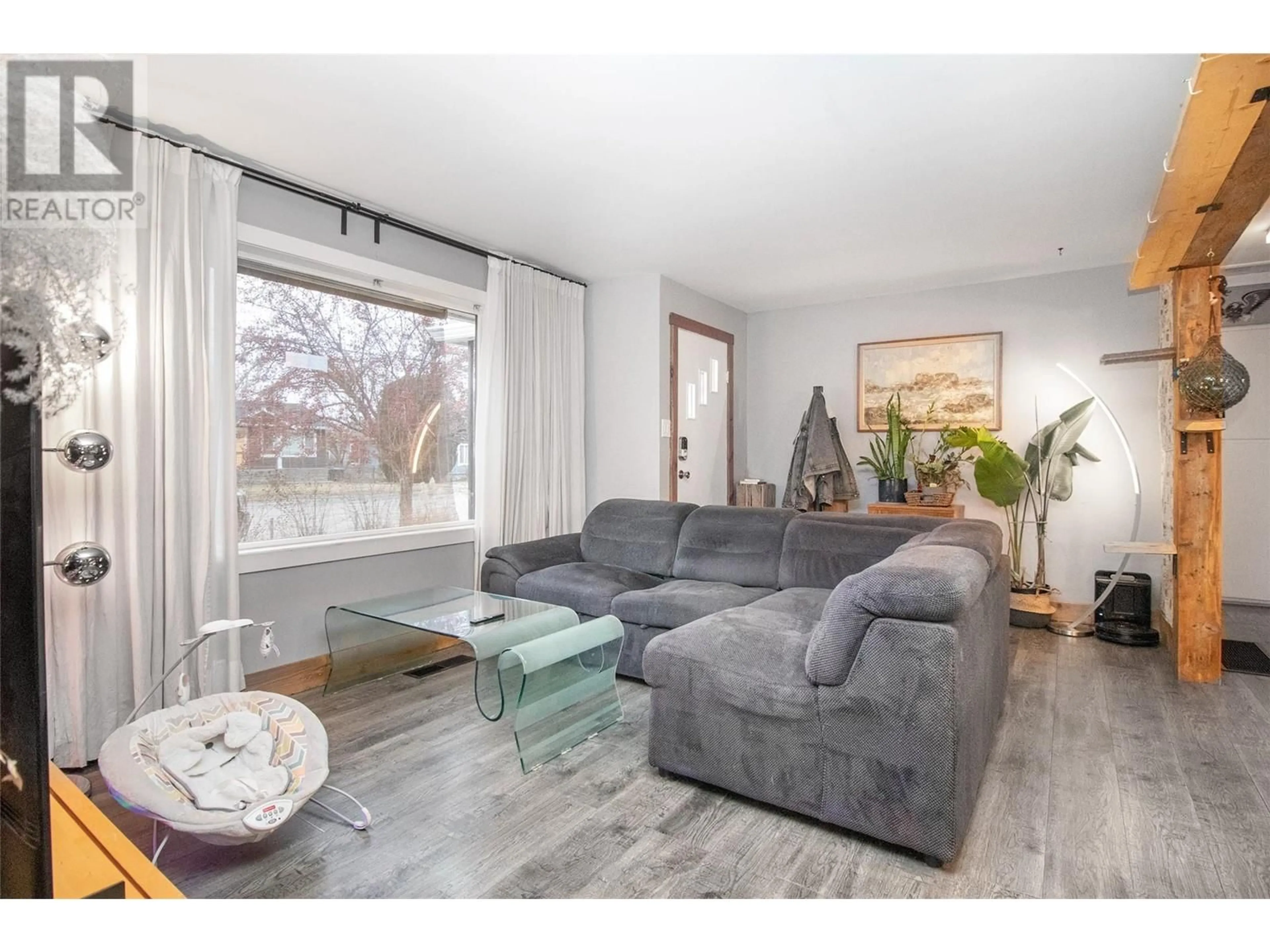 Living room with furniture, wood/laminate floor for 195 Sadler Road, Kelowna British Columbia V1X2Y6