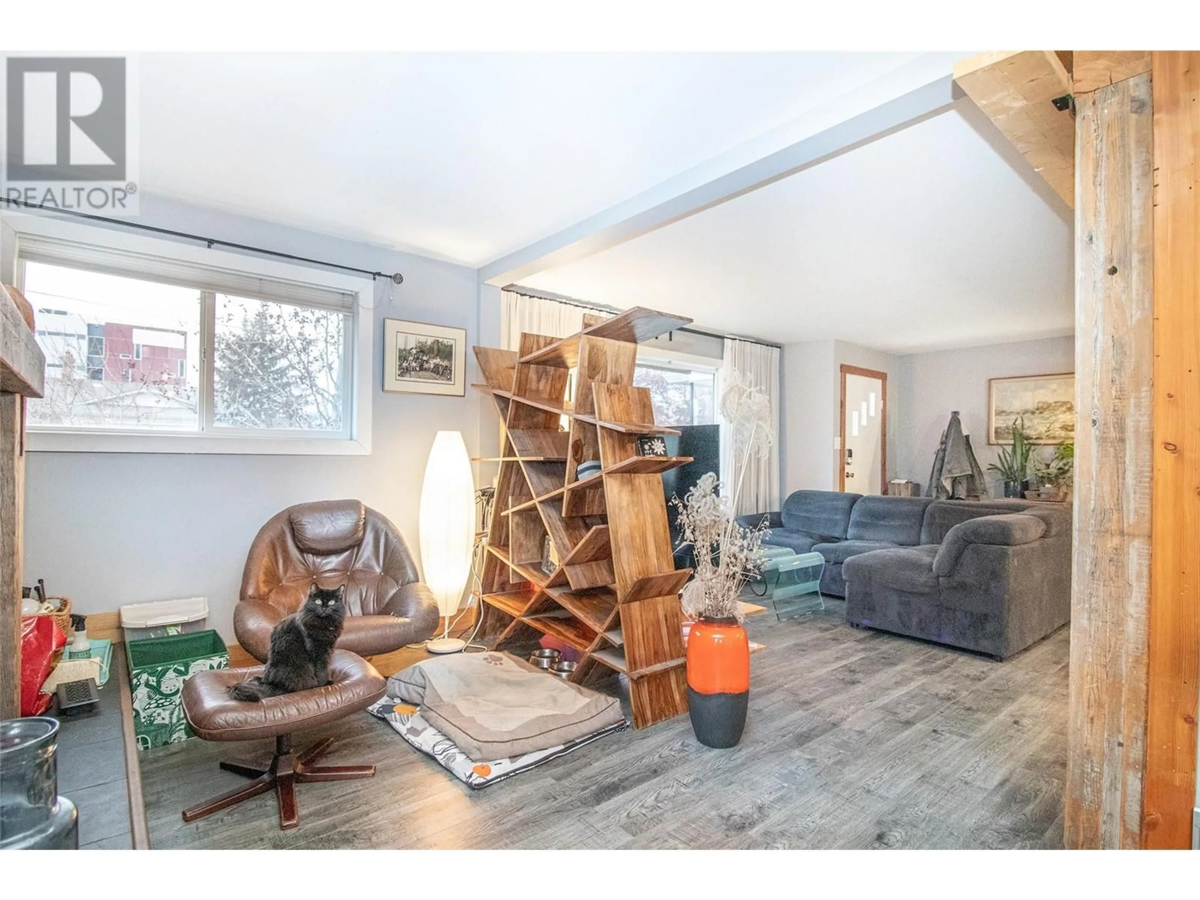 Living room with furniture, wood/laminate floor for 195 Sadler Road, Kelowna British Columbia V1X2Y6