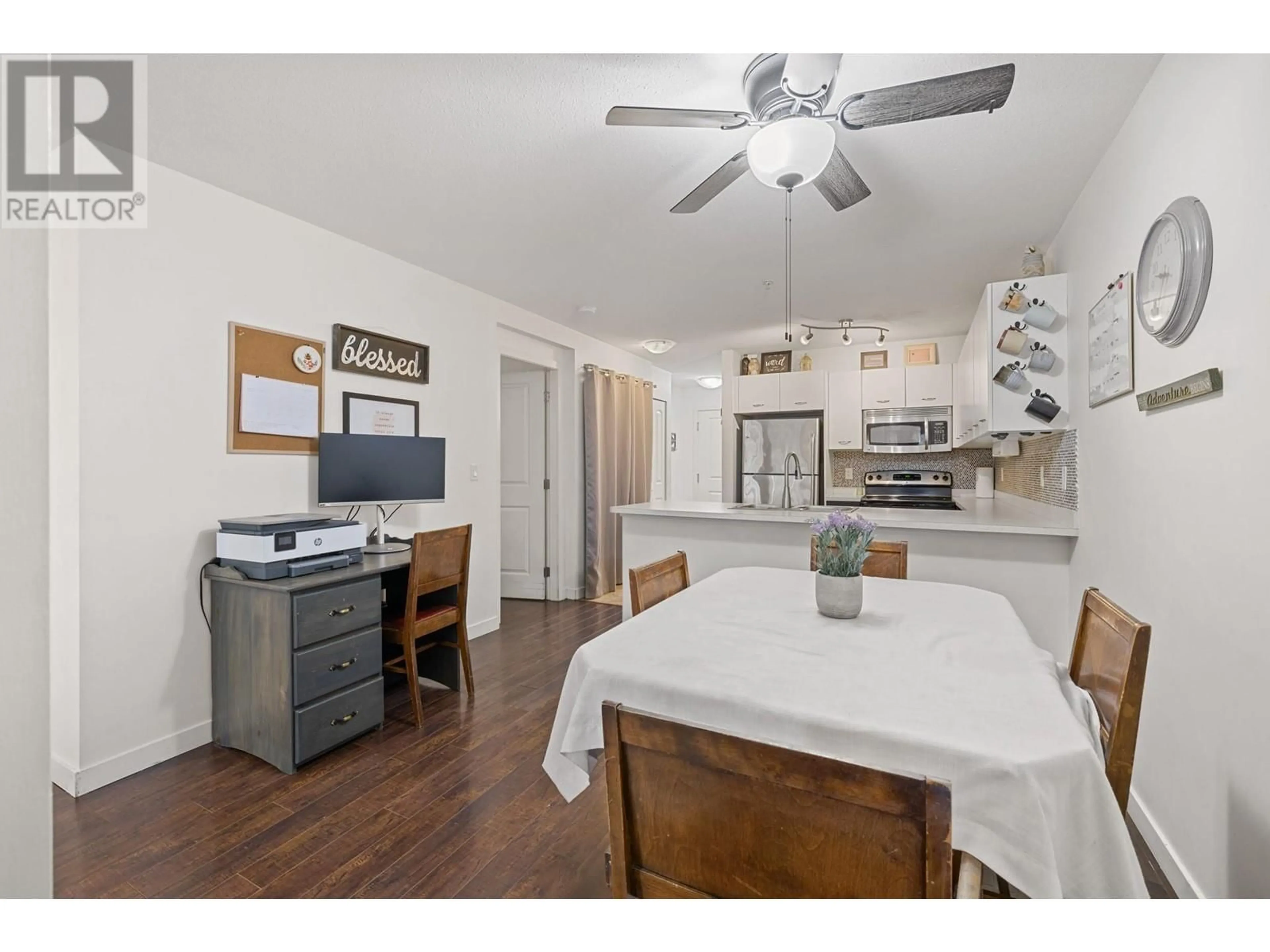 Open concept kitchen, wood/laminate floor for 104 - 539 YATES ROAD, Kelowna British Columbia V1V2T8