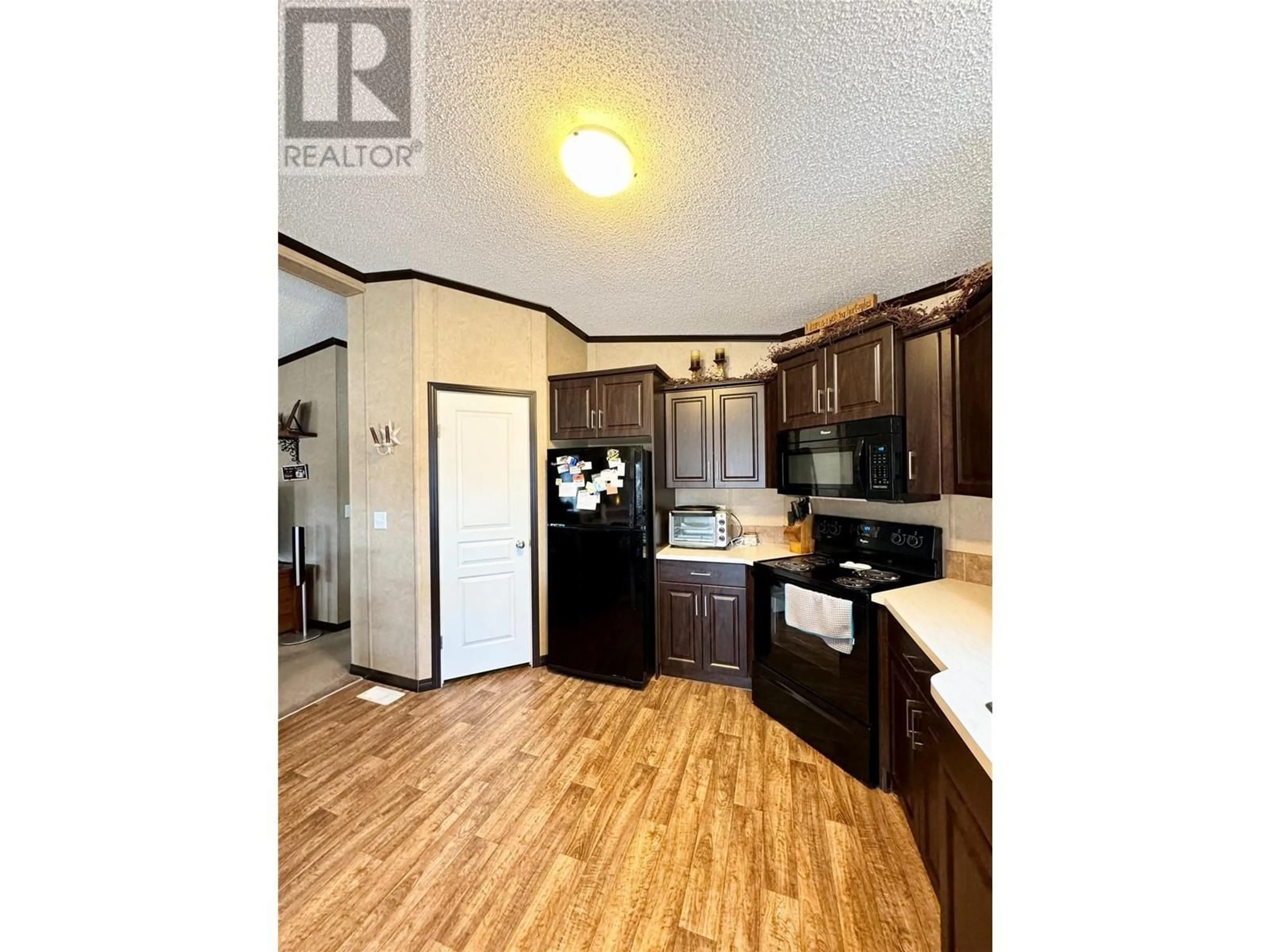 Standard kitchen, wood/laminate floor for 2581 Spring Bank Avenue, Merritt British Columbia V1K1S1