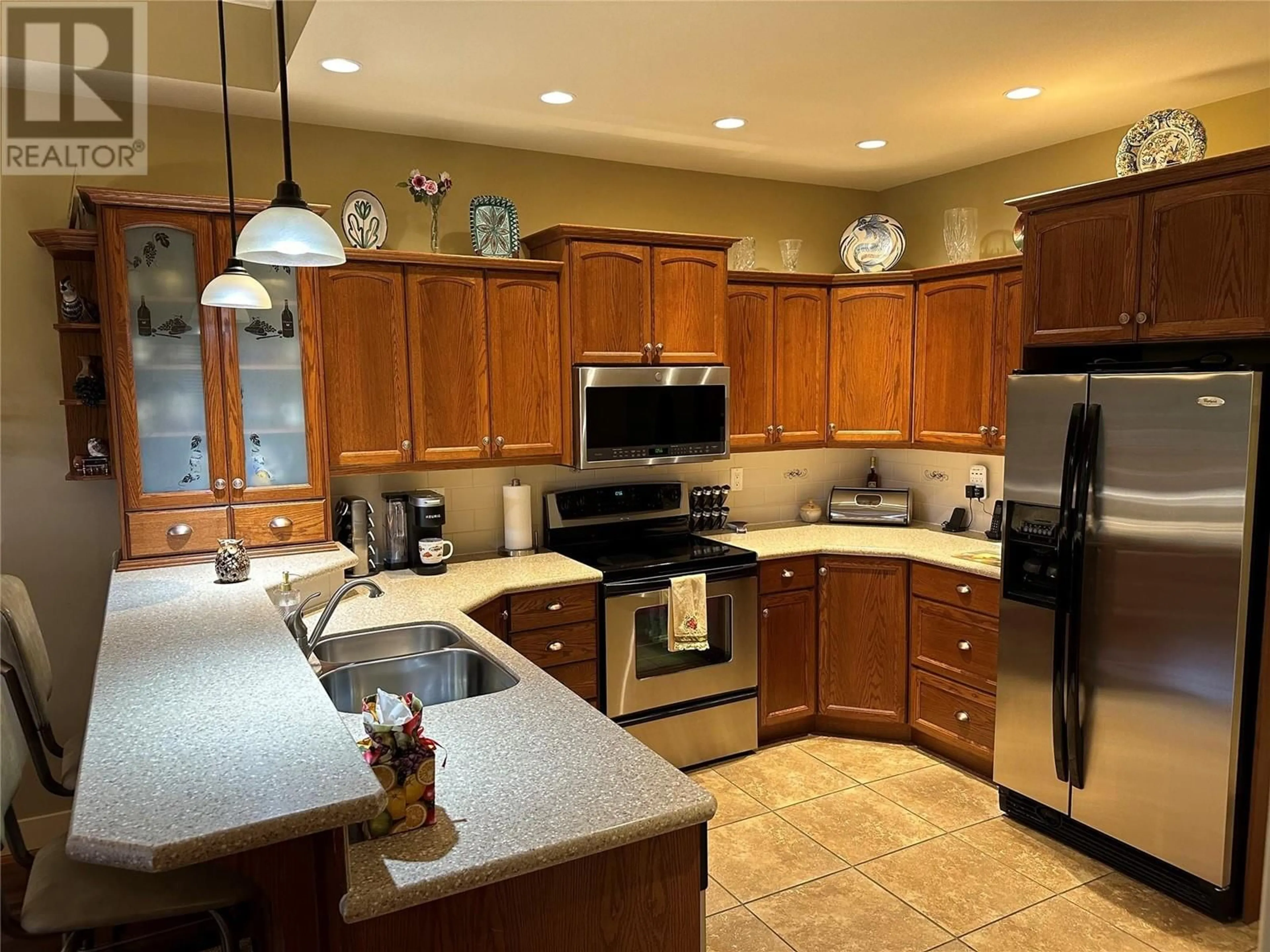 Open concept kitchen, ceramic/tile floor for 109 - 2629 CORNWALL DRIVE, Penticton British Columbia V2A6J3