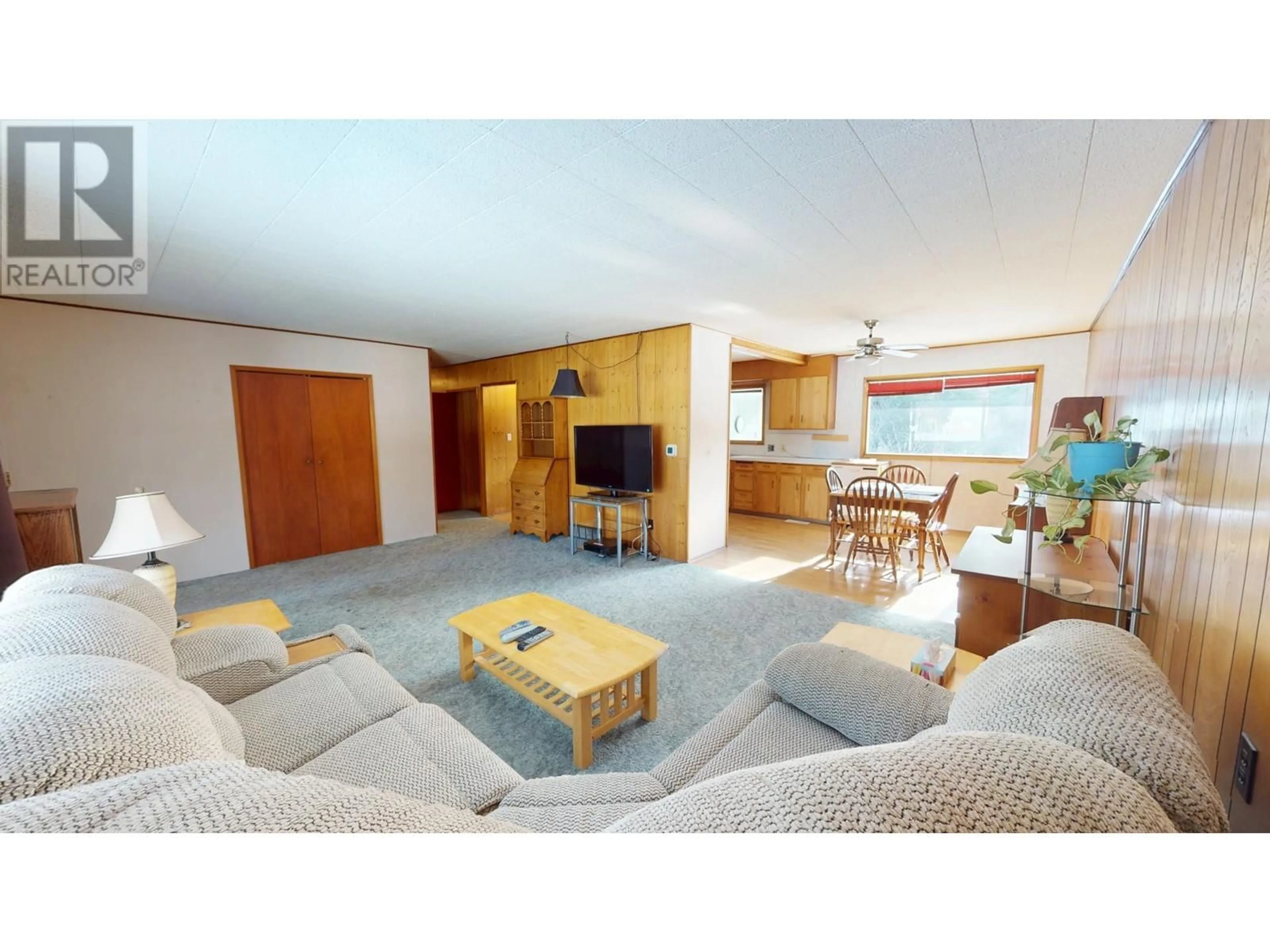 Living room with furniture, wood/laminate floor for 99 TAMARAC AVENUE, Fruitvale British Columbia V0G1L0
