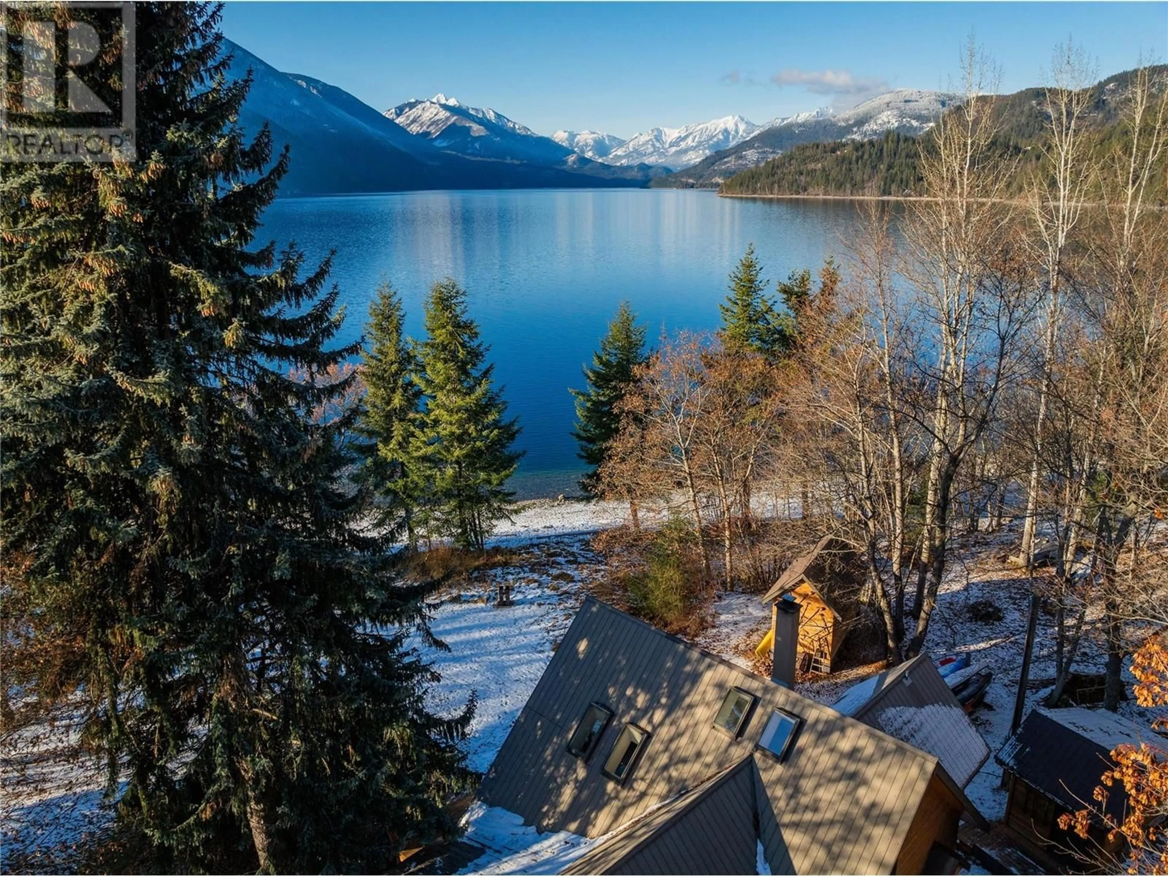 A pic from outside/outdoor area/front of a property/back of a property/a pic from drone, water/lake/river/ocean view for 802 Becker Lane, New Denver British Columbia V0G1S0