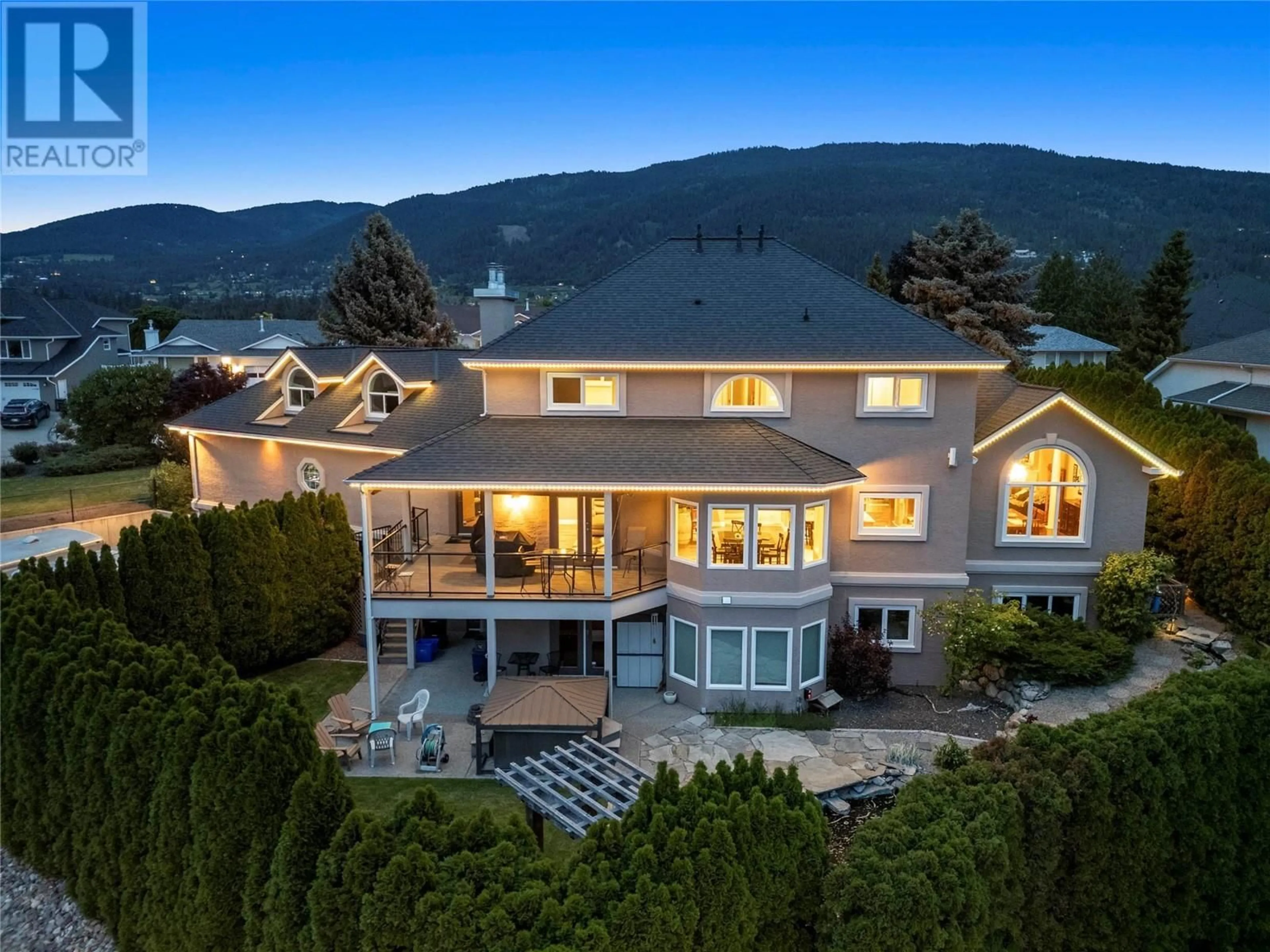 A pic from outside/outdoor area/front of a property/back of a property/a pic from drone, mountain view for 4400 Crystal Drive, Vernon British Columbia V1T8V5