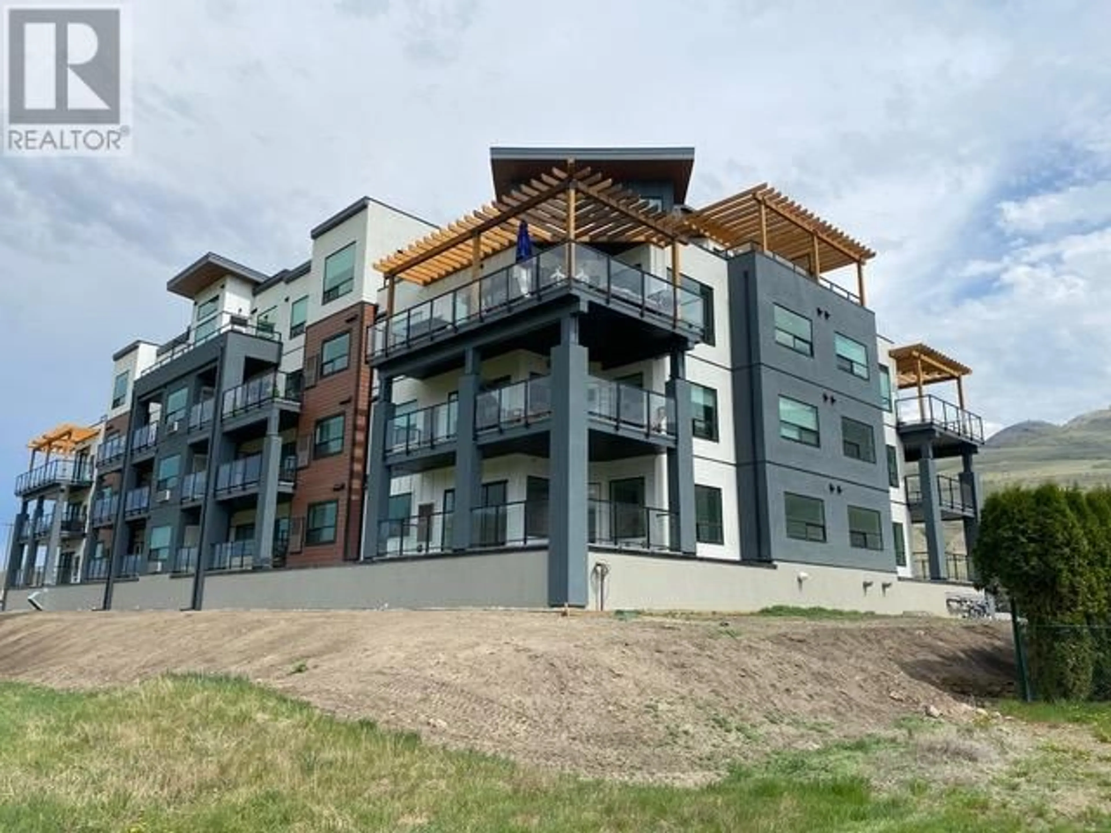 A pic from outside/outdoor area/front of a property/back of a property/a pic from drone, building for 651 DUNES Drive Unit# 101, Kamloops British Columbia V2B8M8