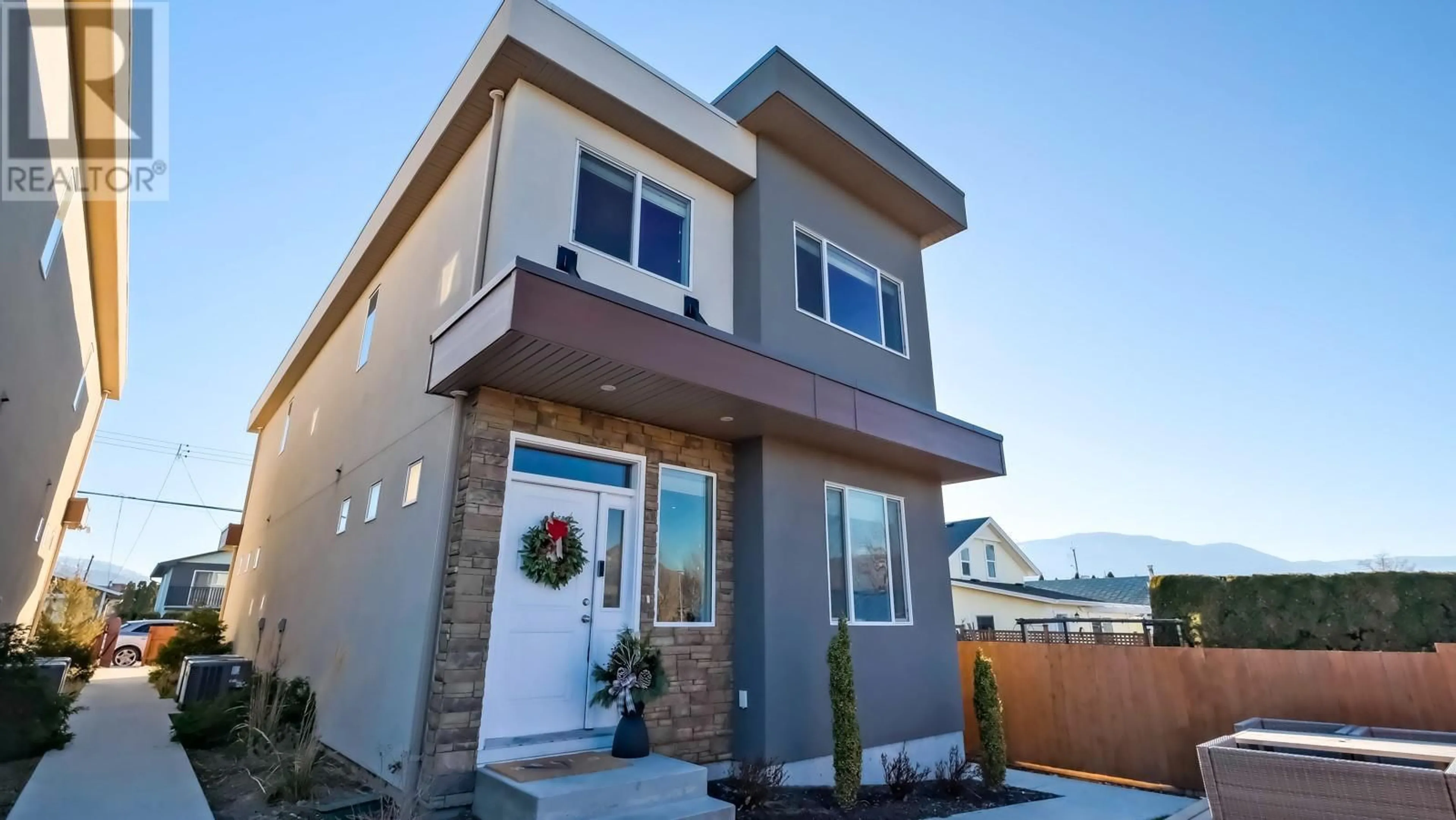 Home with vinyl exterior material, street for 457 NELSON Avenue Unit# 102, Penticton British Columbia V2A2L3