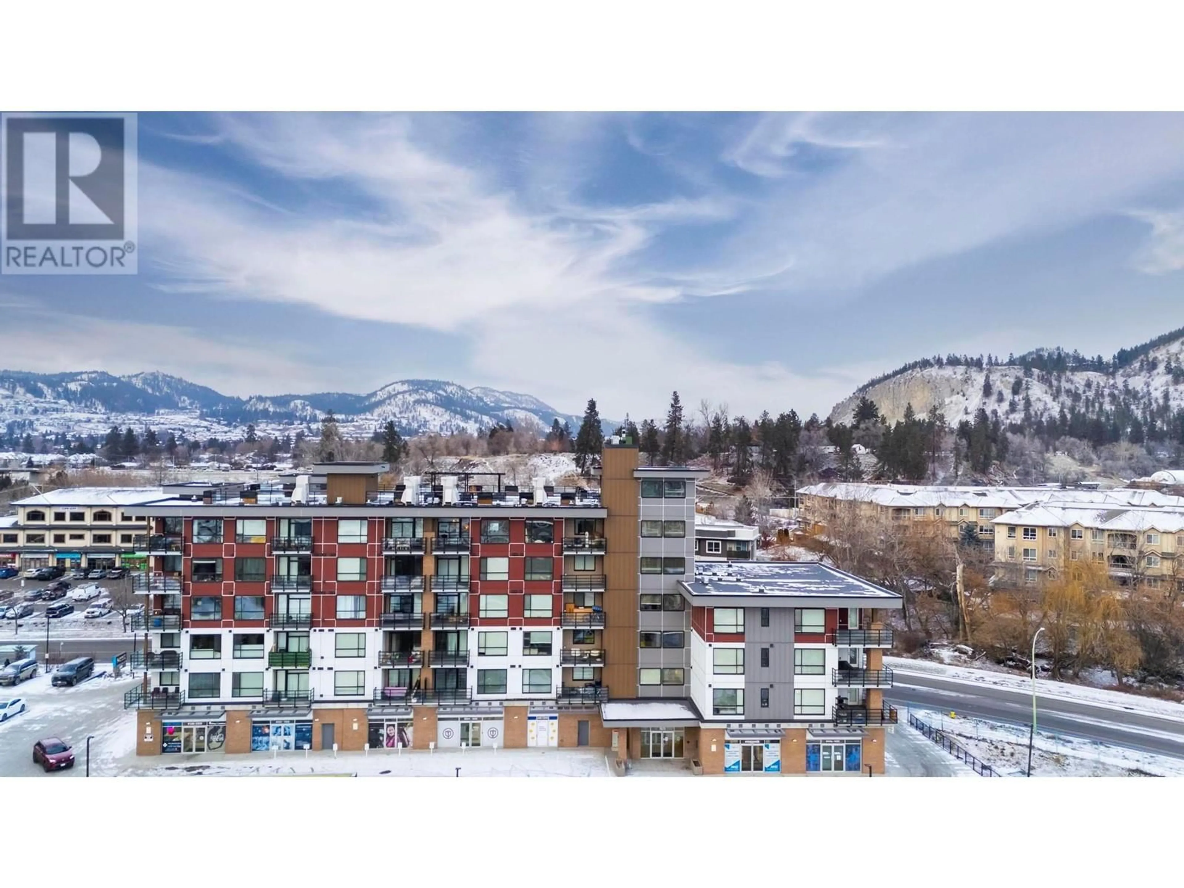 A pic from outside/outdoor area/front of a property/back of a property/a pic from drone, mountain view for 1925 Enterprise Way Unit# 611, Kelowna British Columbia V1Y0J8