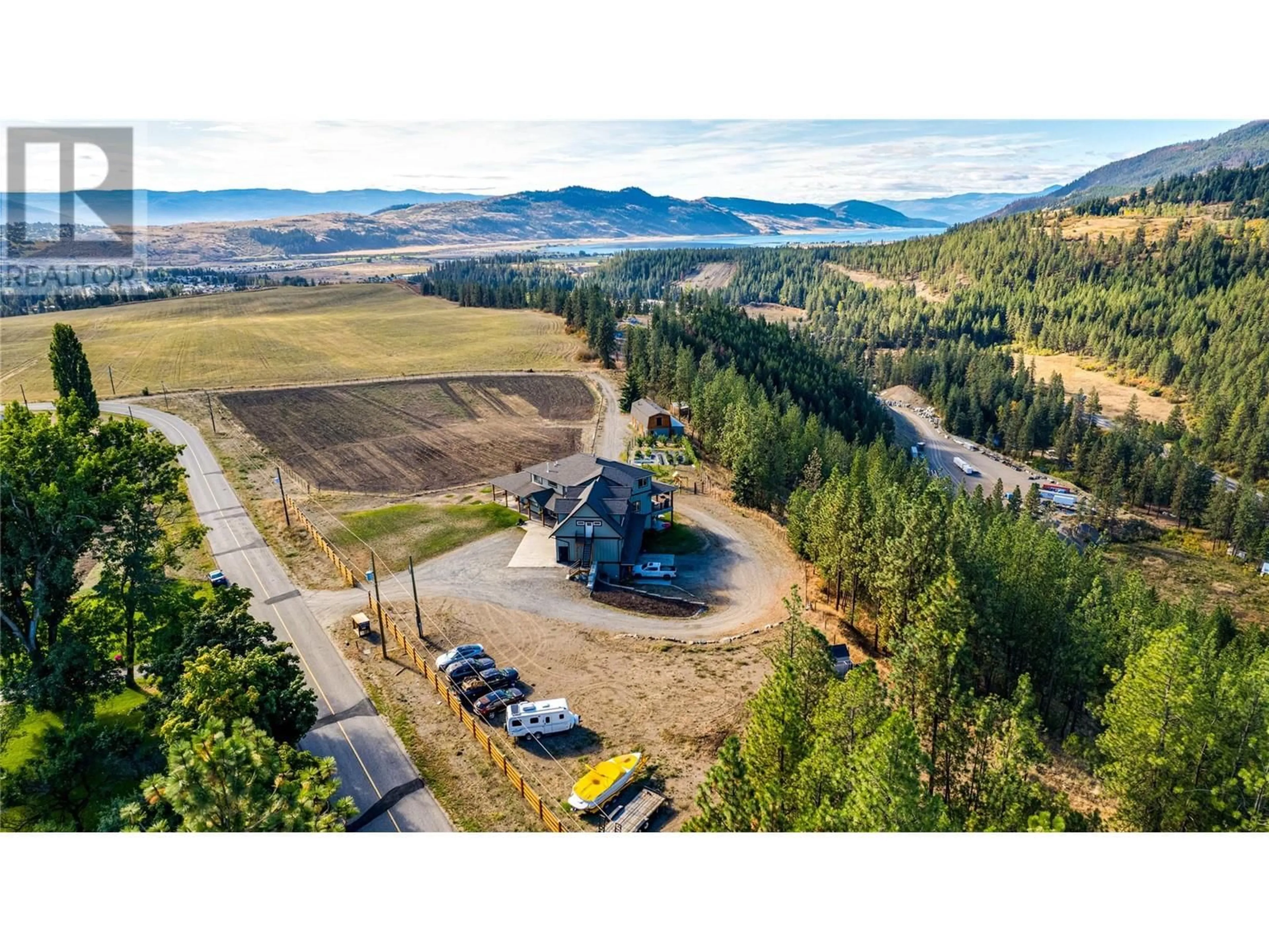 A pic from outside/outdoor area/front of a property/back of a property/a pic from drone, mountain view for 645 St Annes Road, Spallumcheen British Columbia V0E1B5