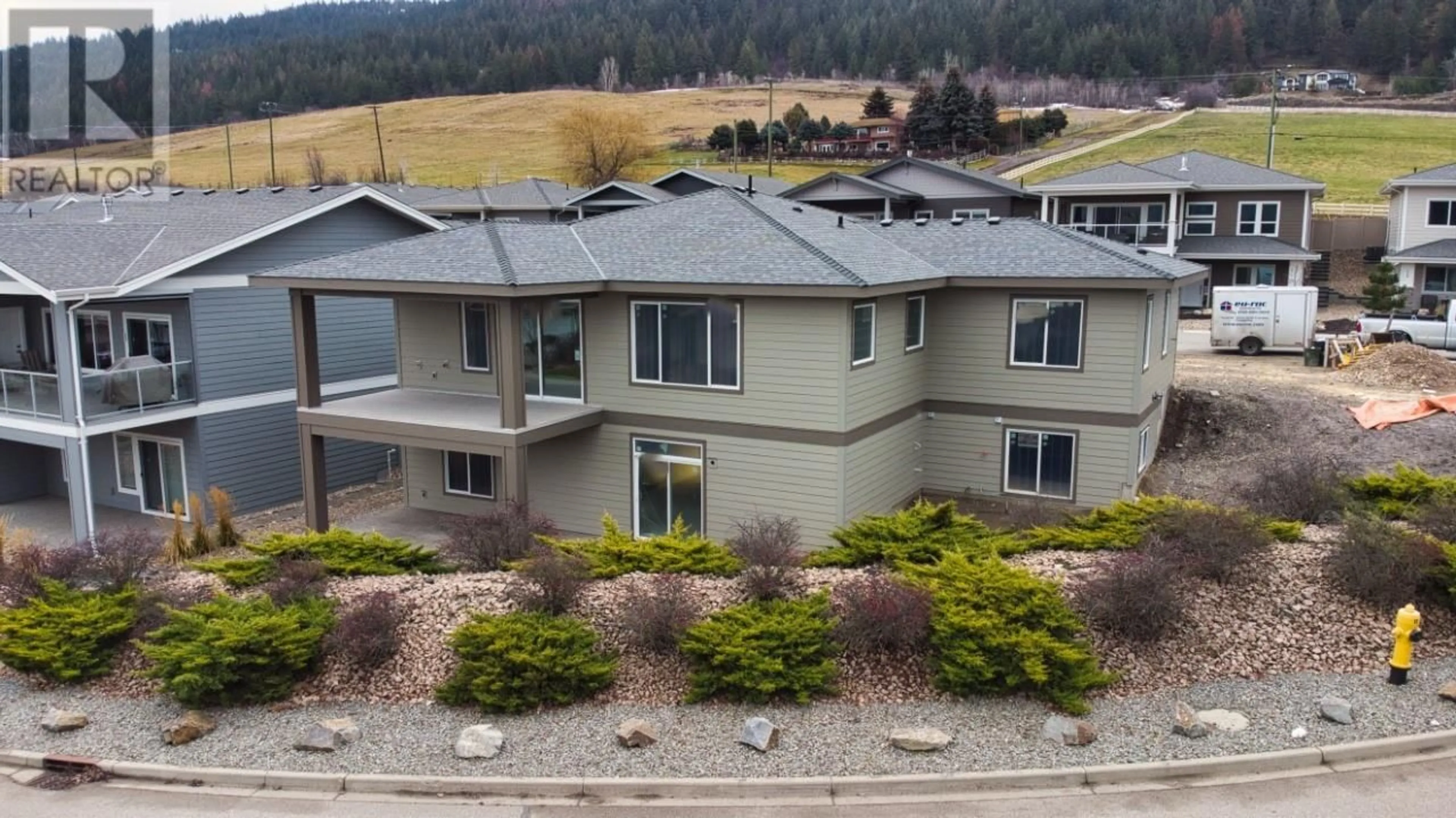 A pic from outside/outdoor area/front of a property/back of a property/a pic from drone, mountain view for 7760 Okanagan Landing Road Unit# 98, Vernon British Columbia V1H1Z4