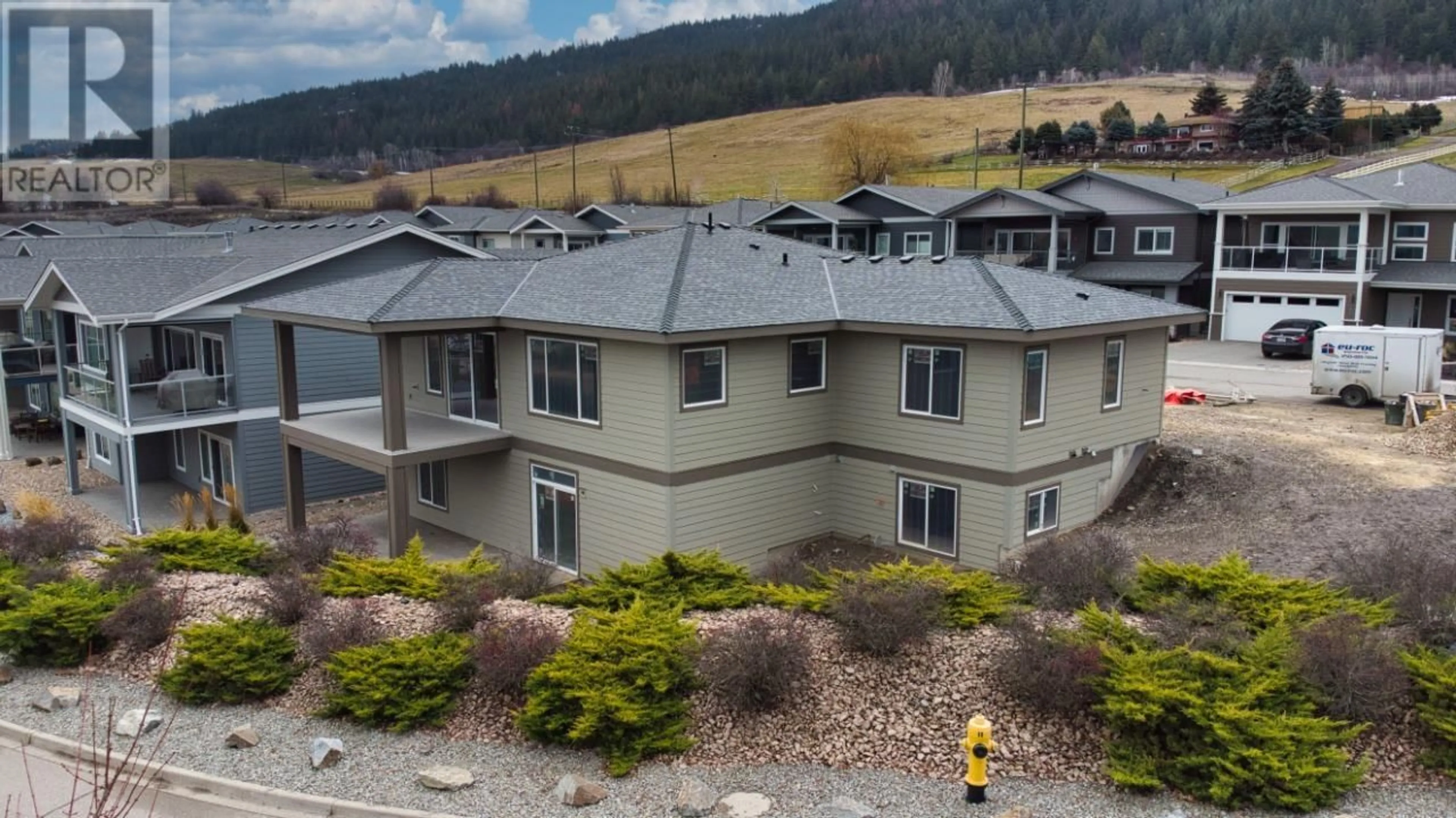 A pic from outside/outdoor area/front of a property/back of a property/a pic from drone, unknown for 7760 Okanagan Landing Road Unit# 98, Vernon British Columbia V1H1Z4