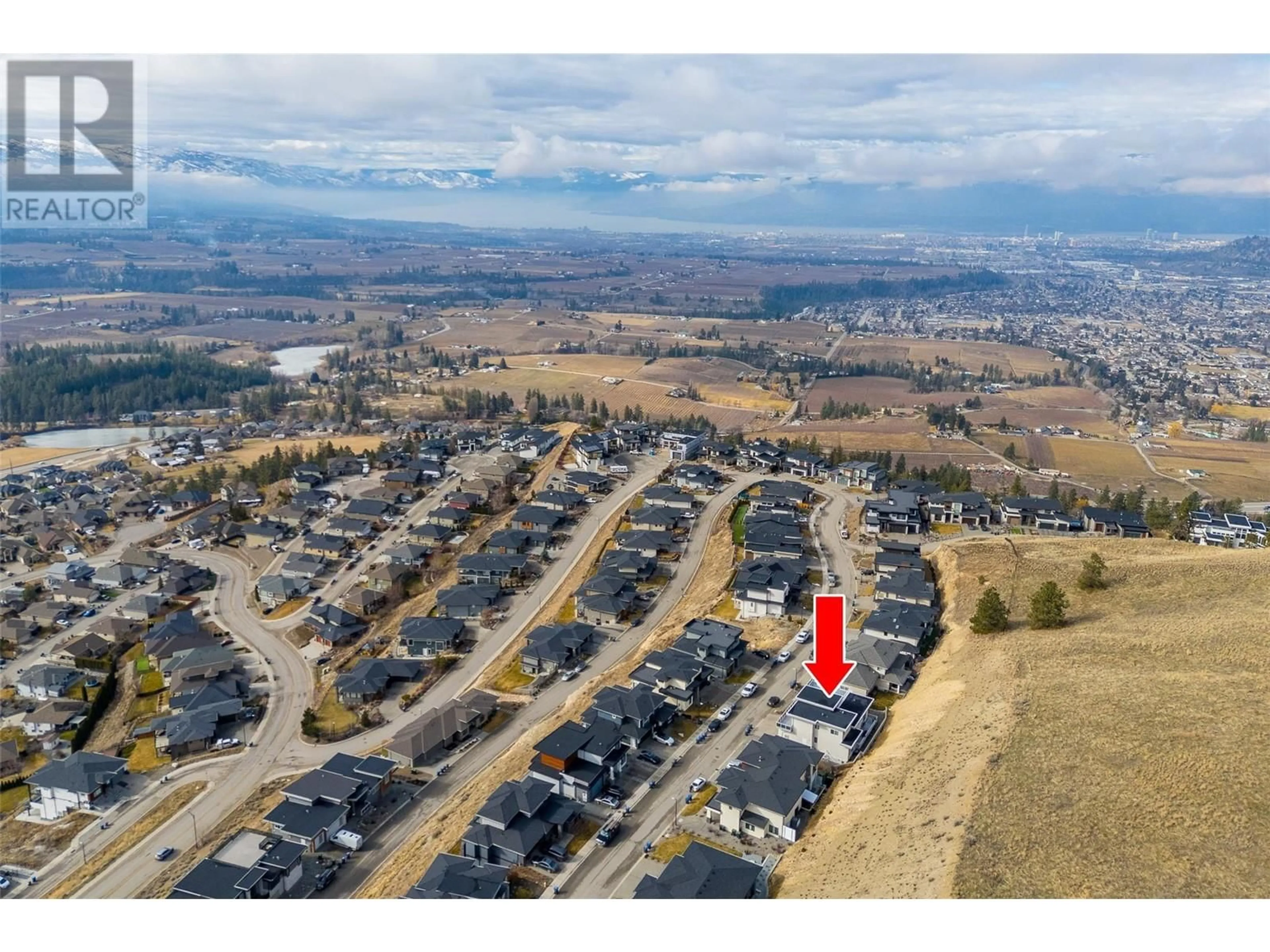 A pic from outside/outdoor area/front of a property/back of a property/a pic from drone, mountain view for 1310 Mine Hill Drive, Kelowna British Columbia V1P1T6