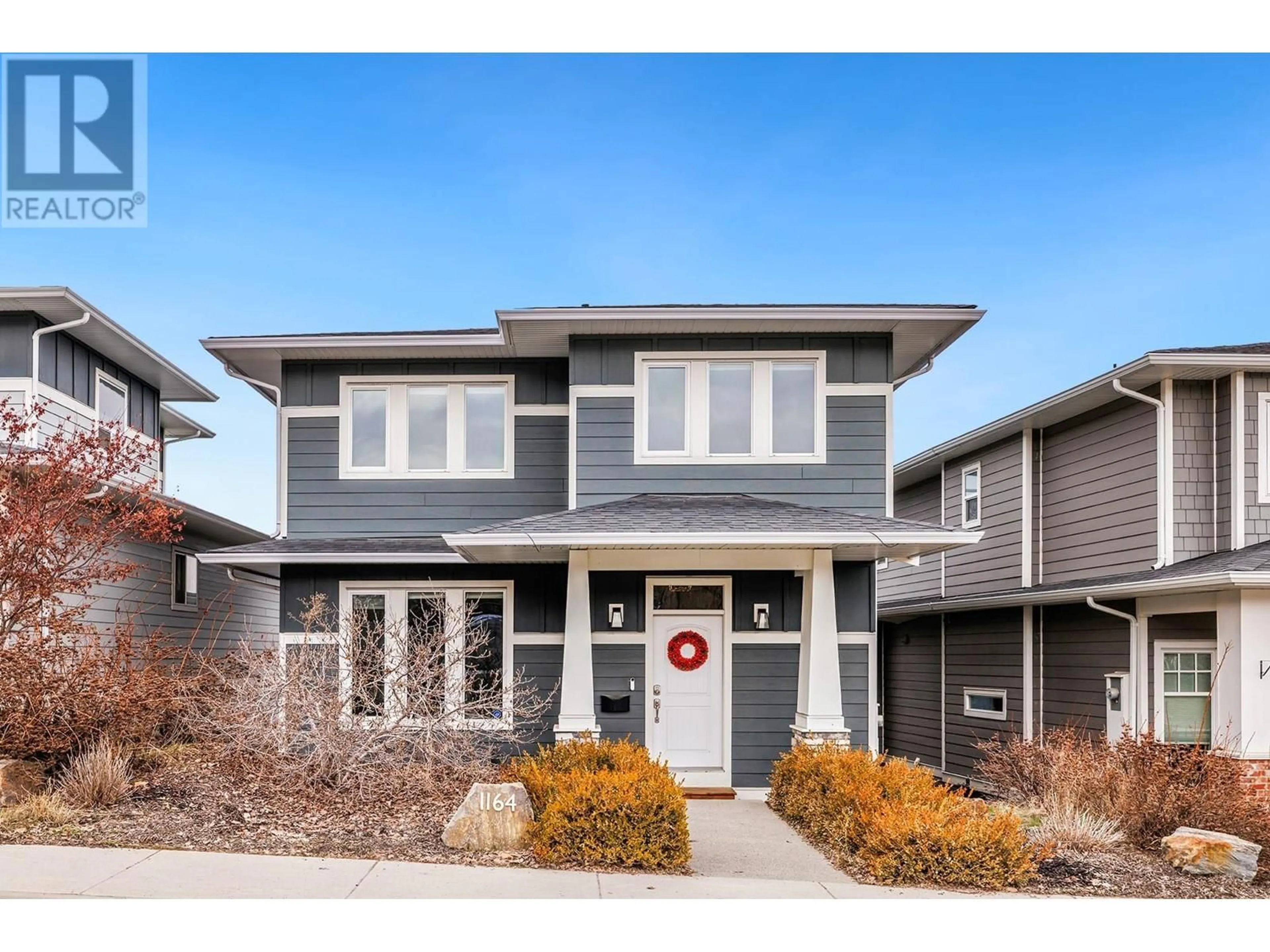 Home with vinyl exterior material, street for 1164 FROST ROAD, Kelowna British Columbia V1W5M1