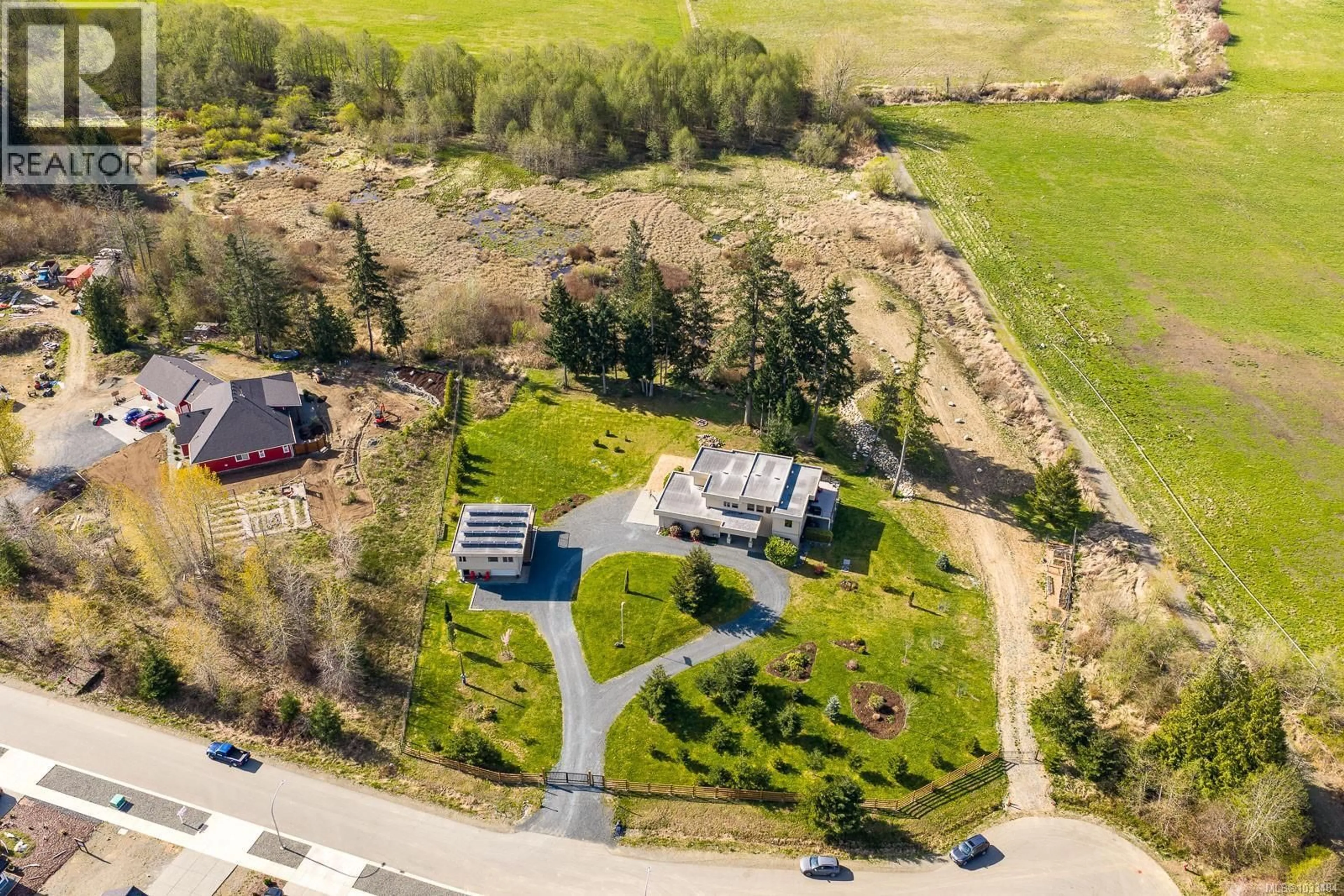 A pic from outside/outdoor area/front of a property/back of a property/a pic from drone, street for 3389 RHYS ROAD, Courtenay British Columbia V9N0B7