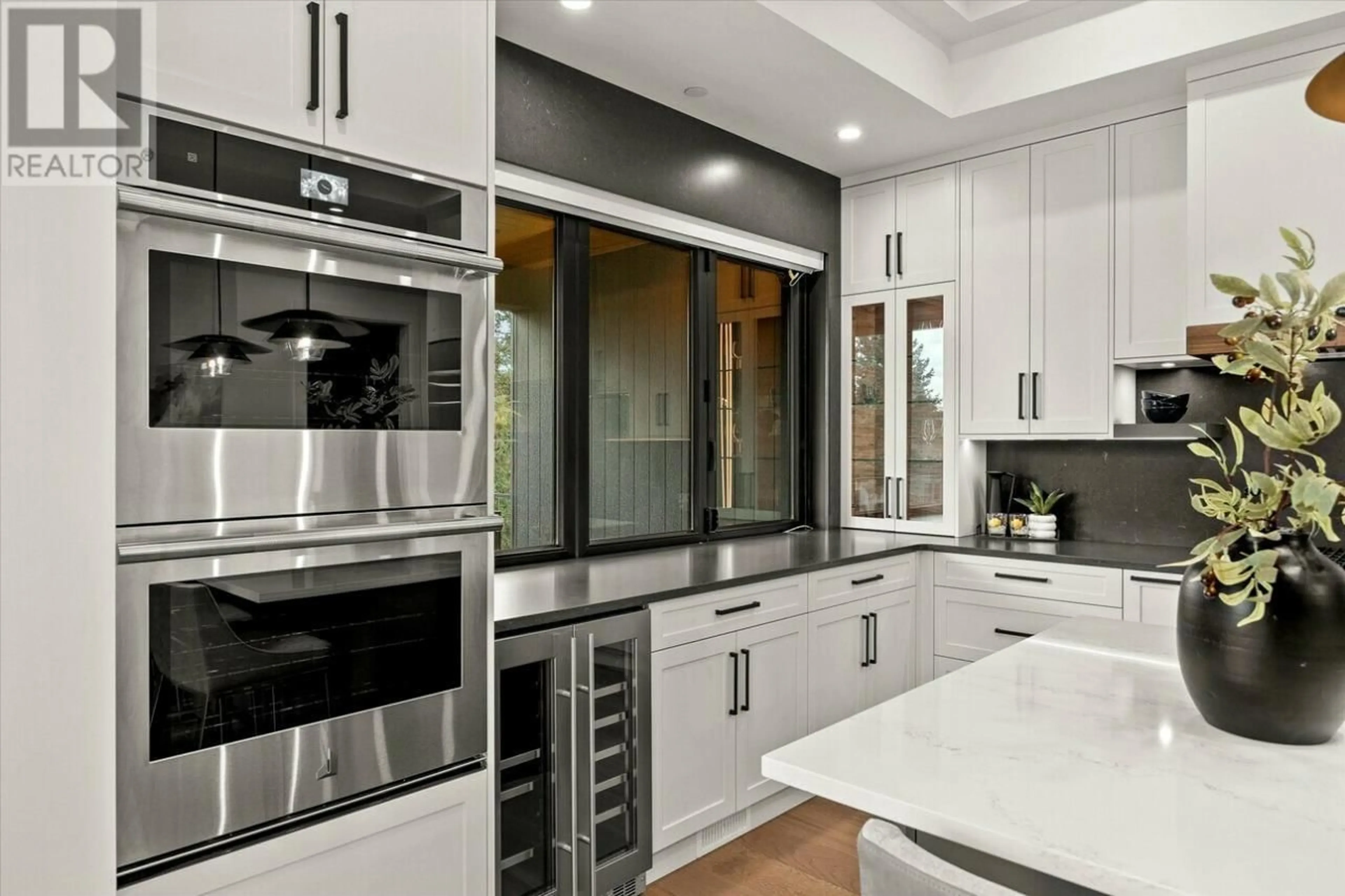 Contemporary kitchen, ceramic/tile floor for 124 WILDSONG CRESCENT WEST, Vernon British Columbia V1H0A8