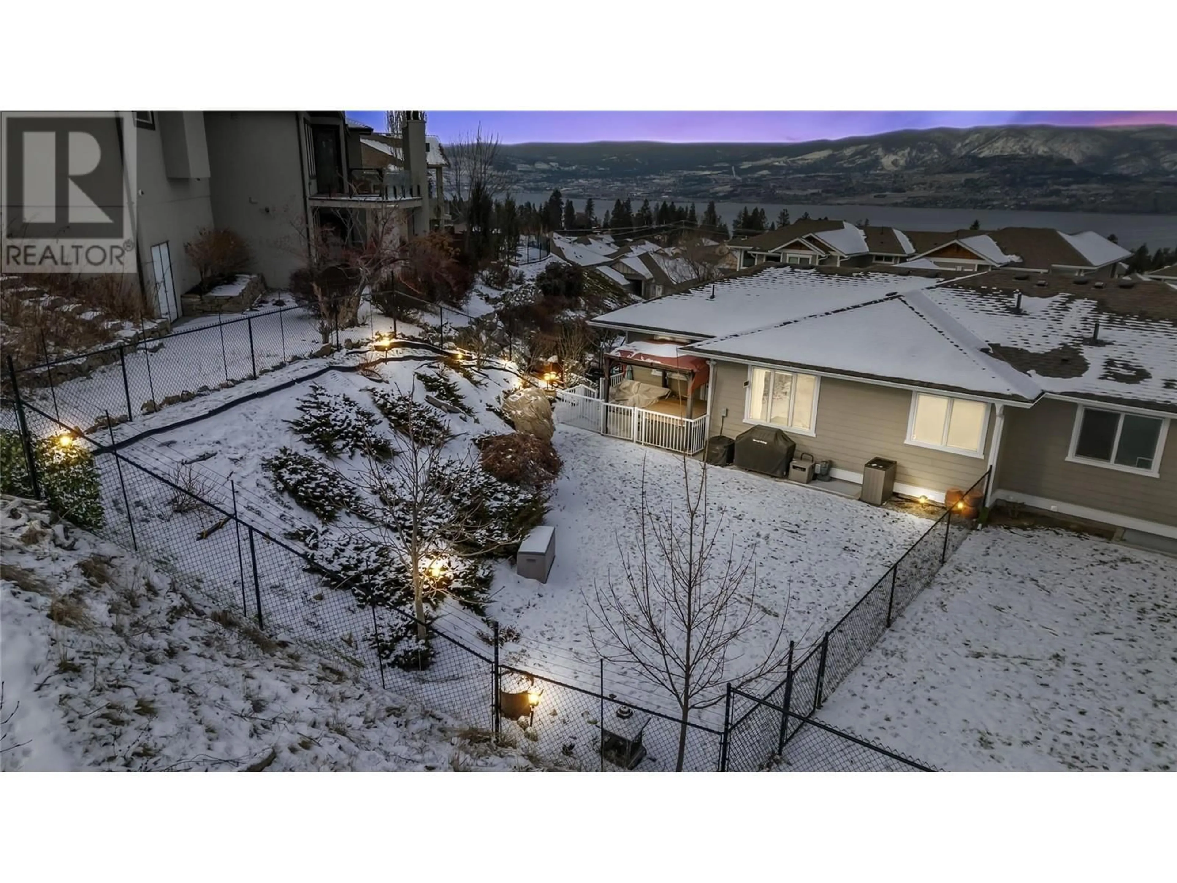 A pic from outside/outdoor area/front of a property/back of a property/a pic from drone, mountain view for 555 Tungsten Court Unit# 8, Kelowna British Columbia V1W4W8