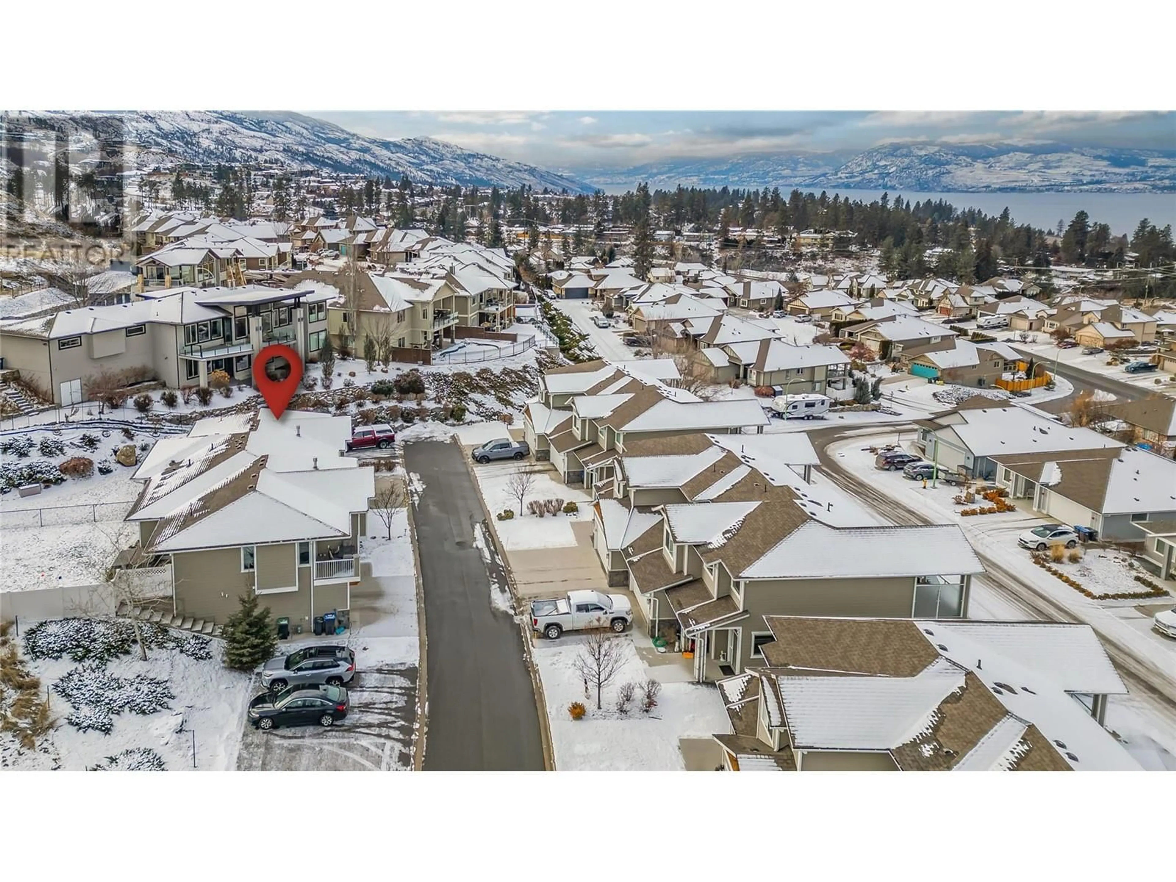 A pic from outside/outdoor area/front of a property/back of a property/a pic from drone, mountain view for 555 Tungsten Court Unit# 8, Kelowna British Columbia V1W4W8