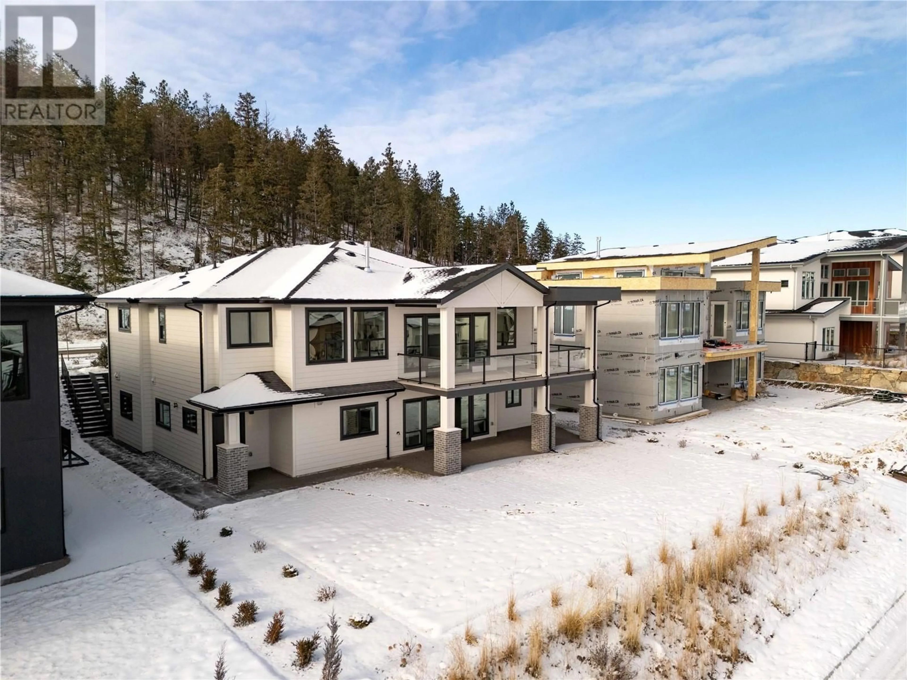 A pic from outside/outdoor area/front of a property/back of a property/a pic from drone, mountain view for 893 Loseth Drive, Kelowna British Columbia V1P0A8