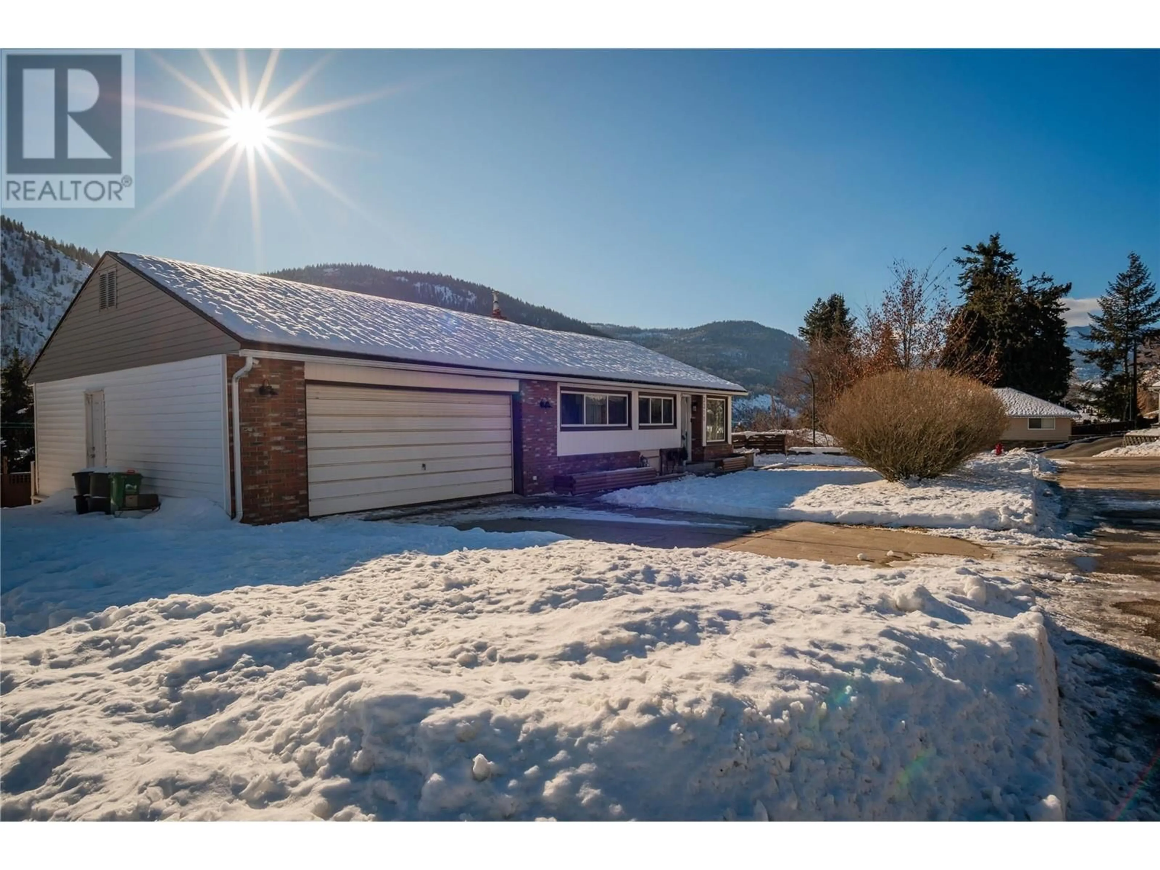 A pic from outside/outdoor area/front of a property/back of a property/a pic from drone, mountain view for 3310 Dahlia Crescent, Trail British Columbia V1R2X9