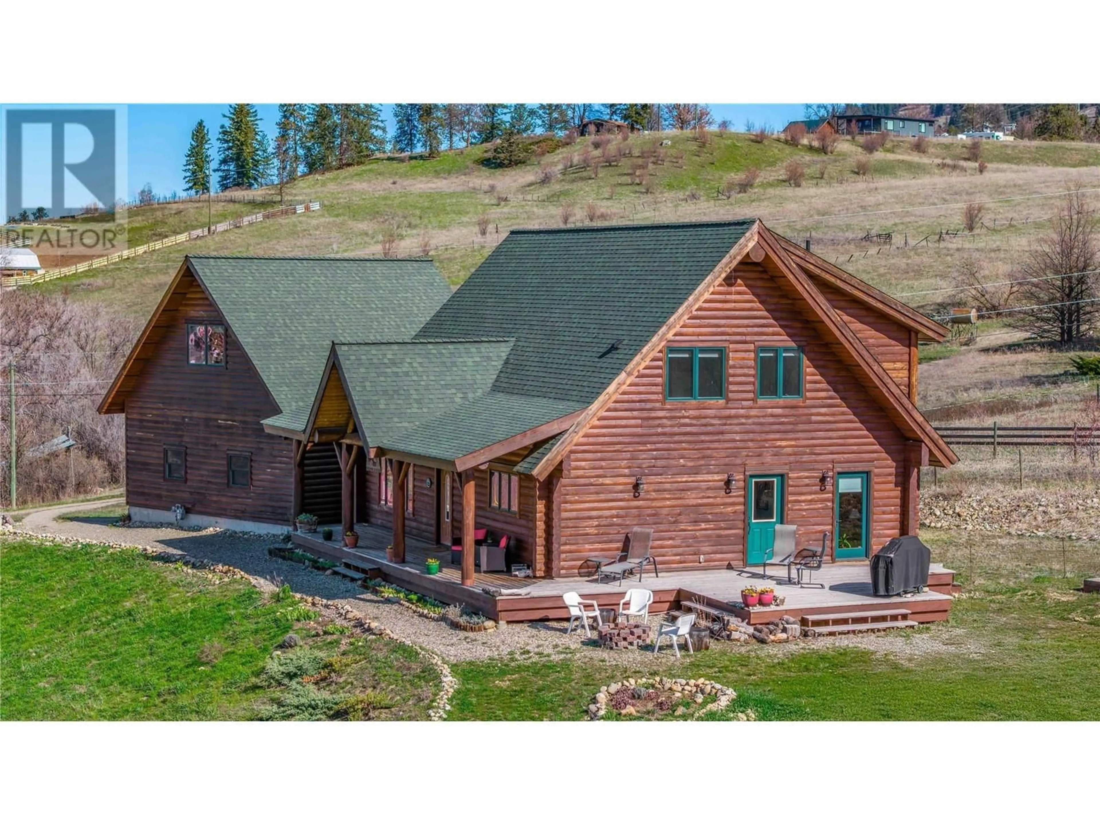 A pic from outside/outdoor area/front of a property/back of a property/a pic from drone, mountain view for 9371 6 HIGHWAY, Coldstream British Columbia V1B3B5