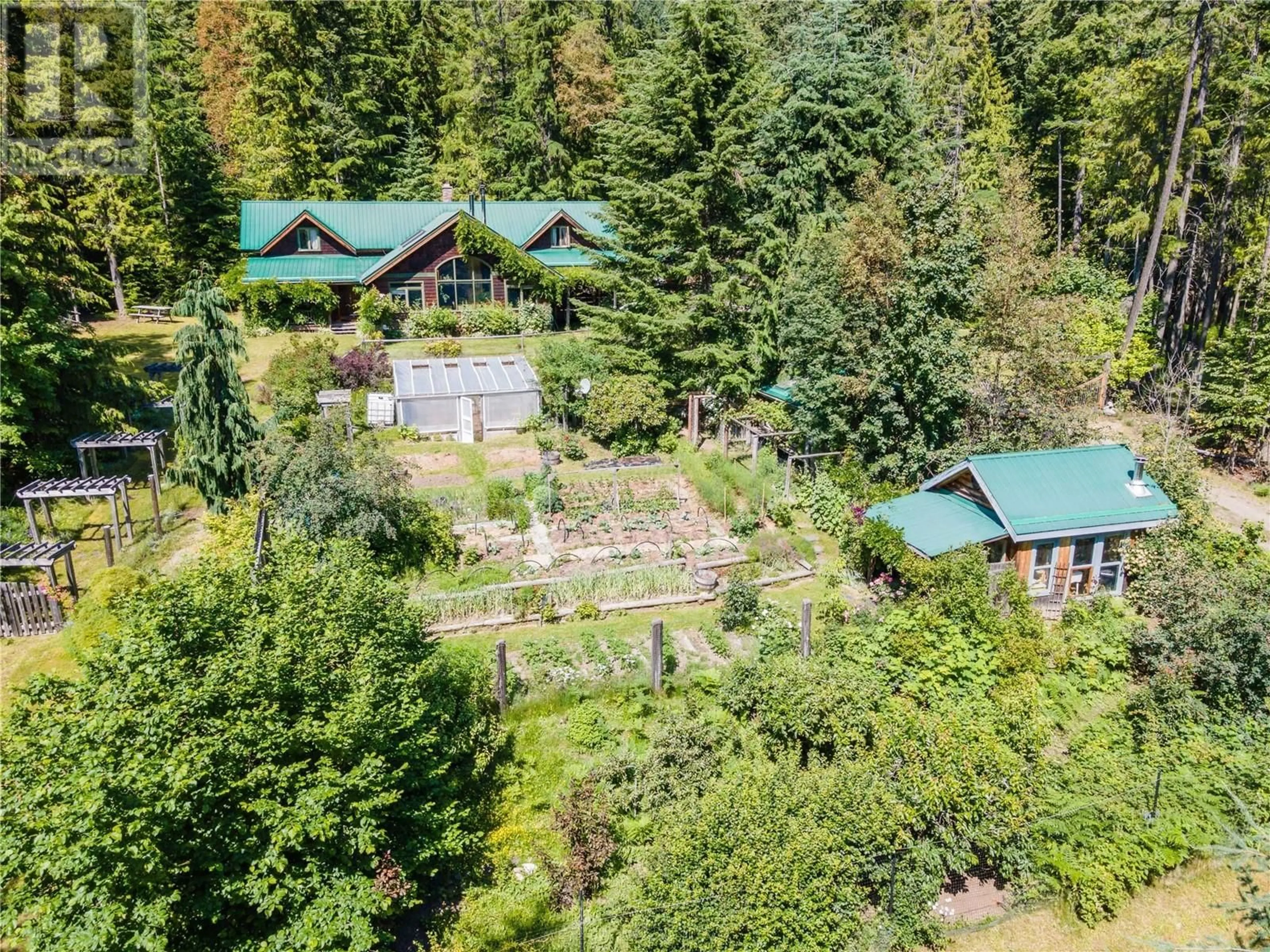 A pic from outside/outdoor area/front of a property/back of a property/a pic from drone, forest/trees view for 9323 Shutty Bench Road, Kaslo British Columbia V0G1M0