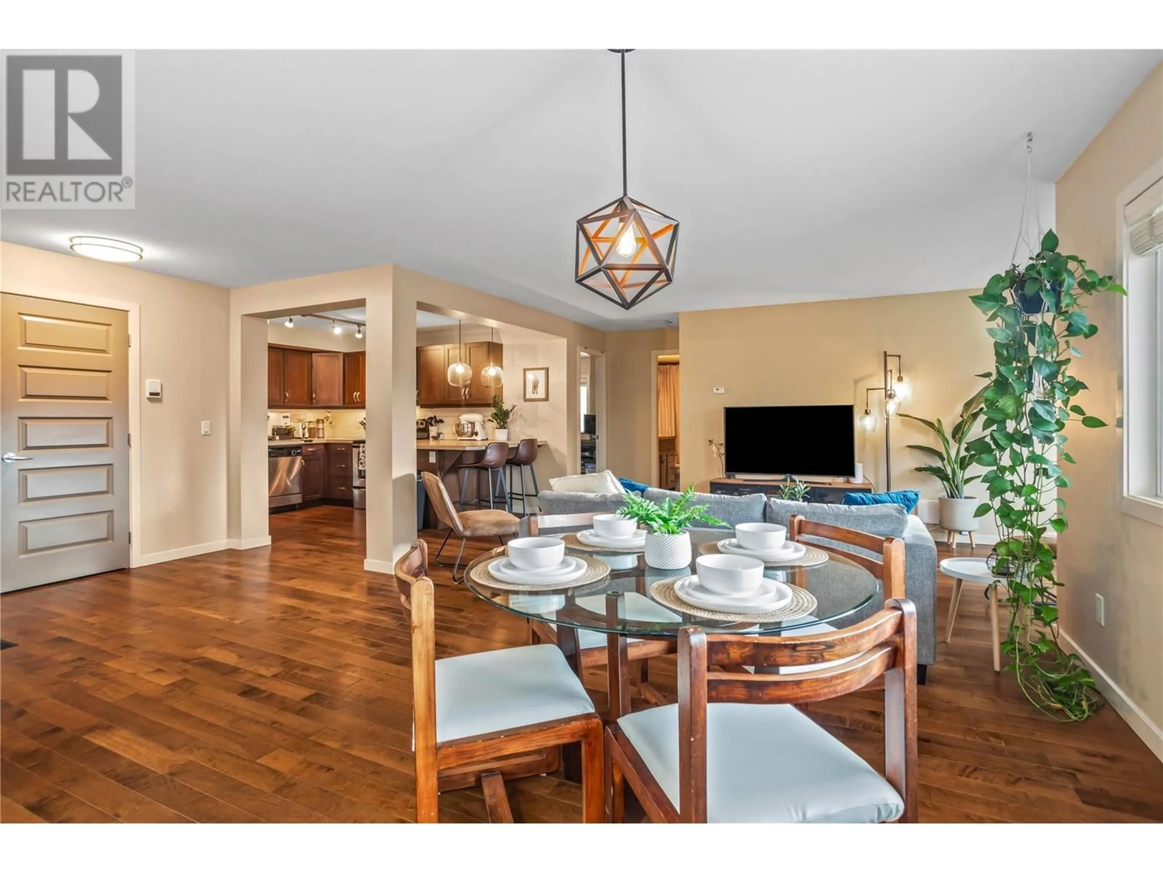 Dining room, wood/laminate floor for 1777 Water Street Unit# 310, Kelowna British Columbia V1Y1K4