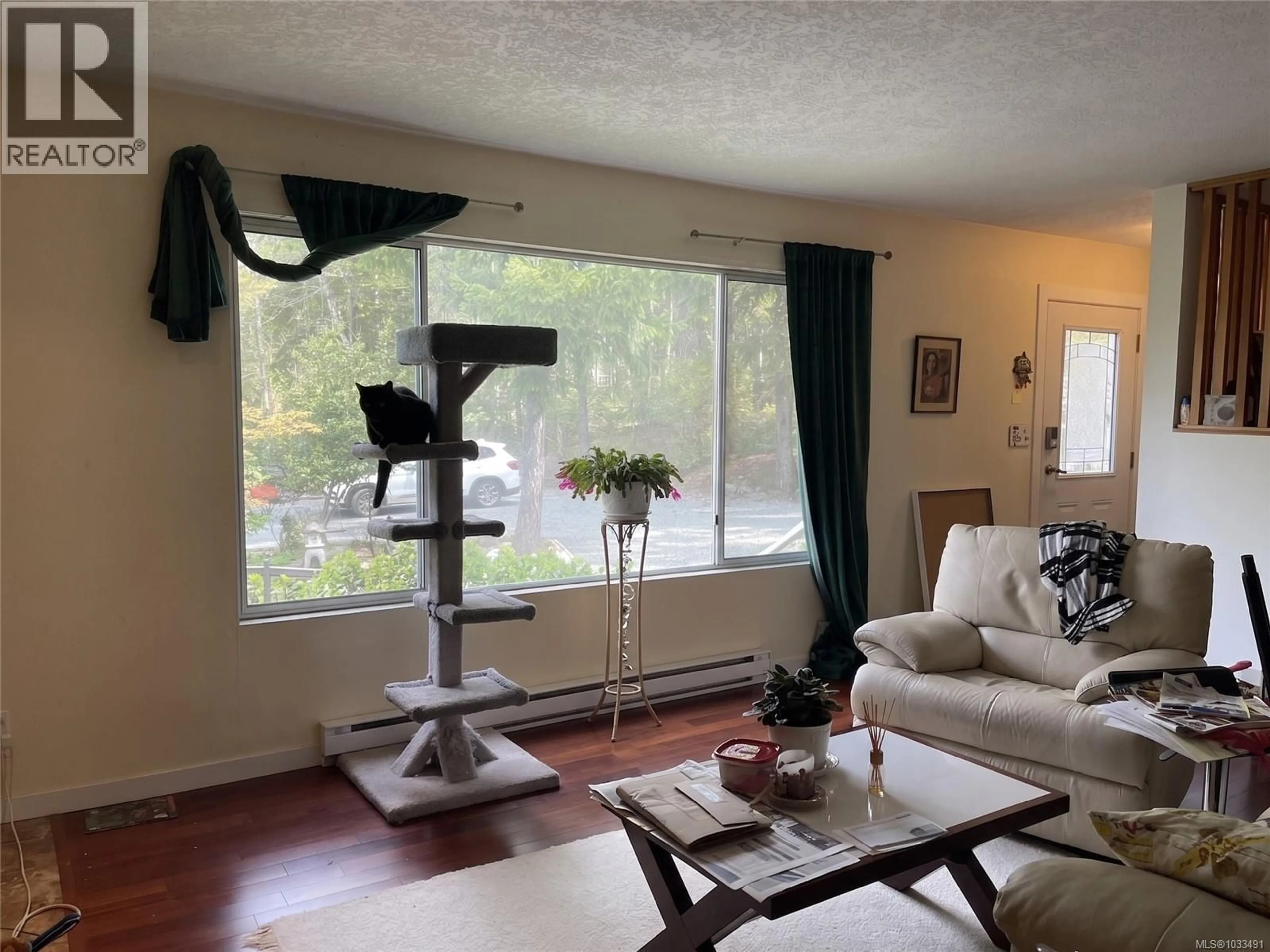 Living room with furniture, wood/laminate floor for 6351 RENTON ROAD NORTH, Port Alberni British Columbia V9Y8S8