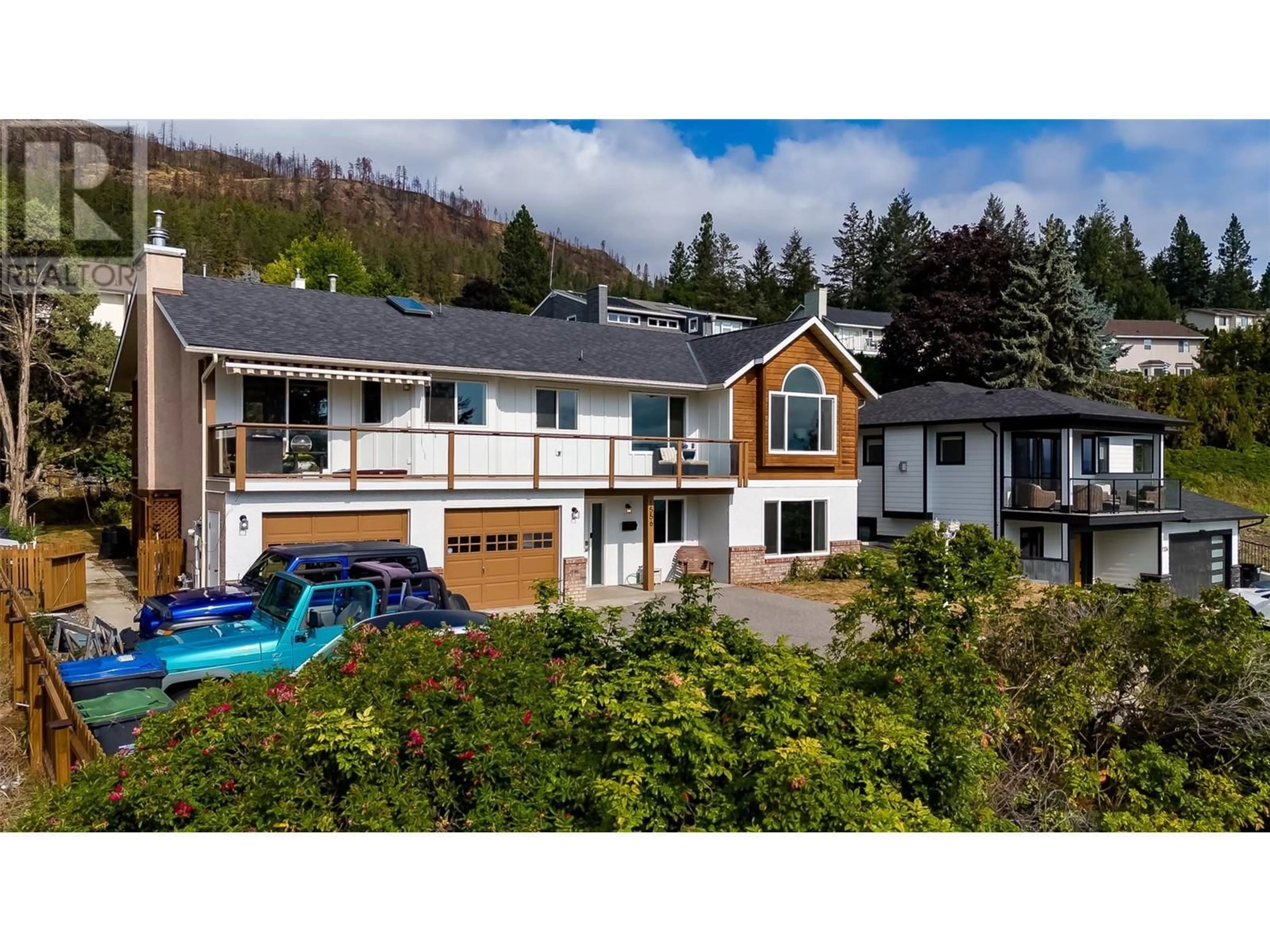 A pic from outside/outdoor area/front of a property/back of a property/a pic from drone, mountain view for 1556 Blackwood Drive, Kelowna British Columbia V1Z3B7