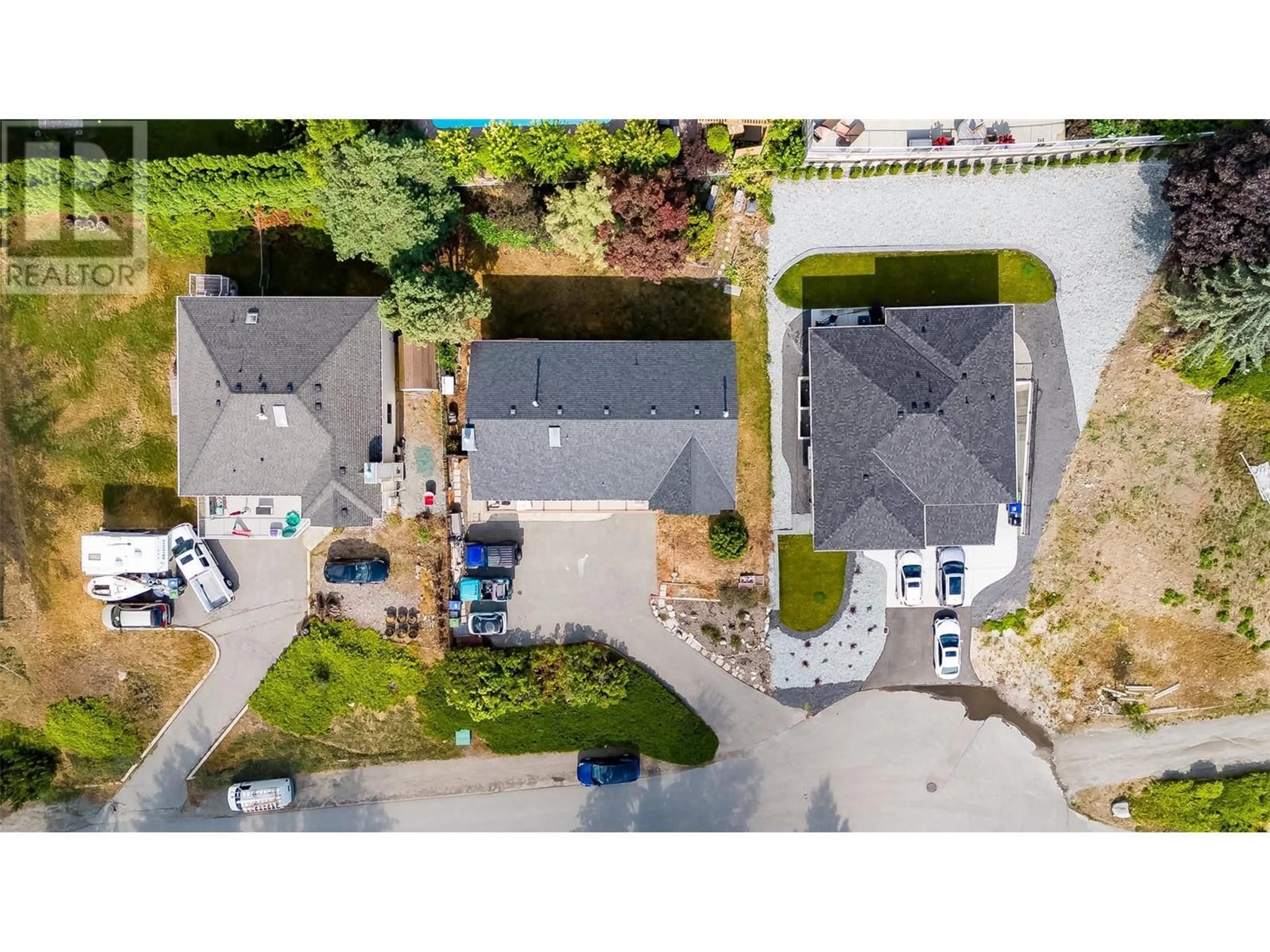 A pic from outside/outdoor area/front of a property/back of a property/a pic from drone, street for 1556 Blackwood Drive, Kelowna British Columbia V1Z3B7