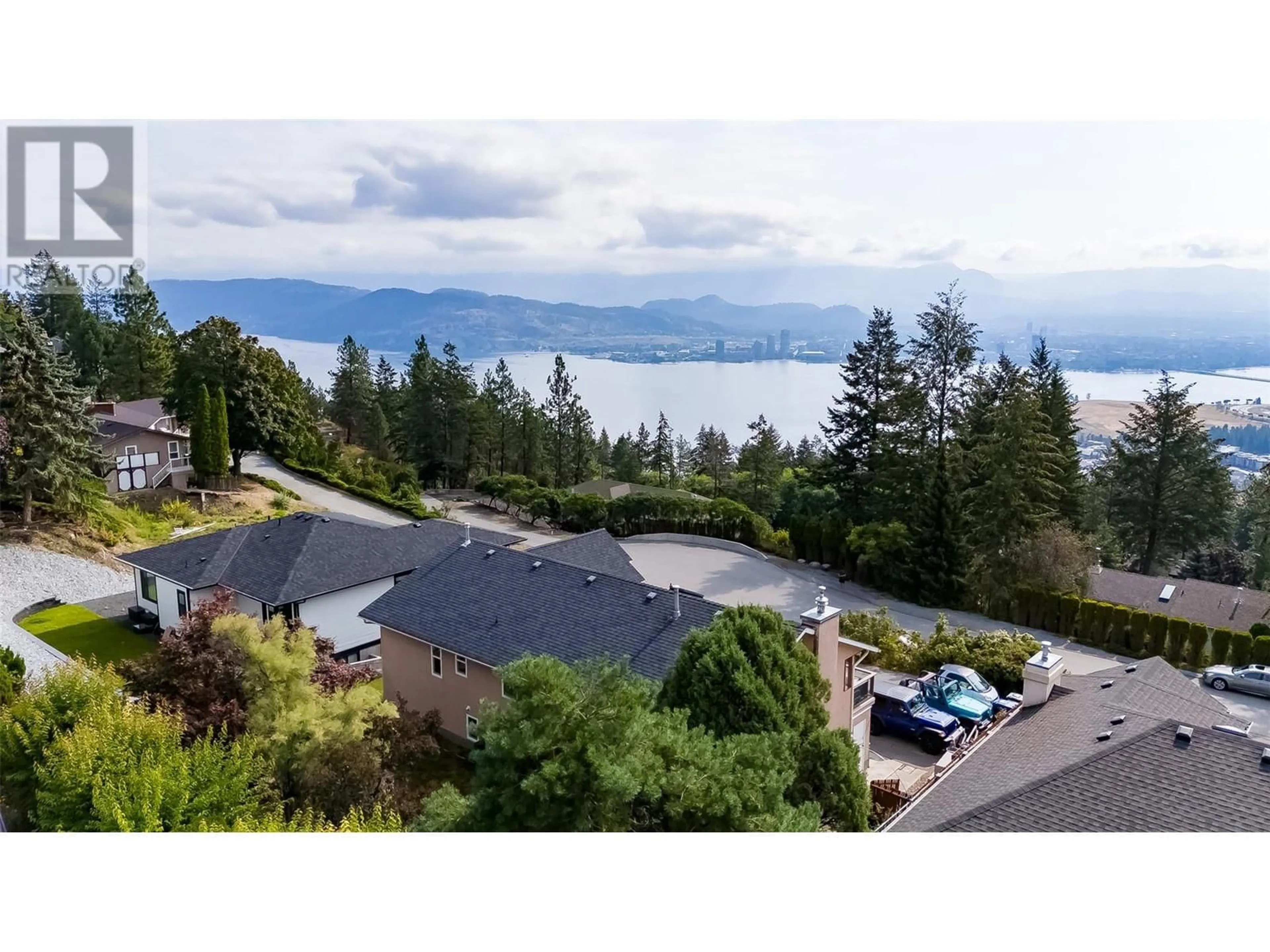 A pic from outside/outdoor area/front of a property/back of a property/a pic from drone, water/lake/river/ocean view for 1556 Blackwood Drive, Kelowna British Columbia V1Z3B7