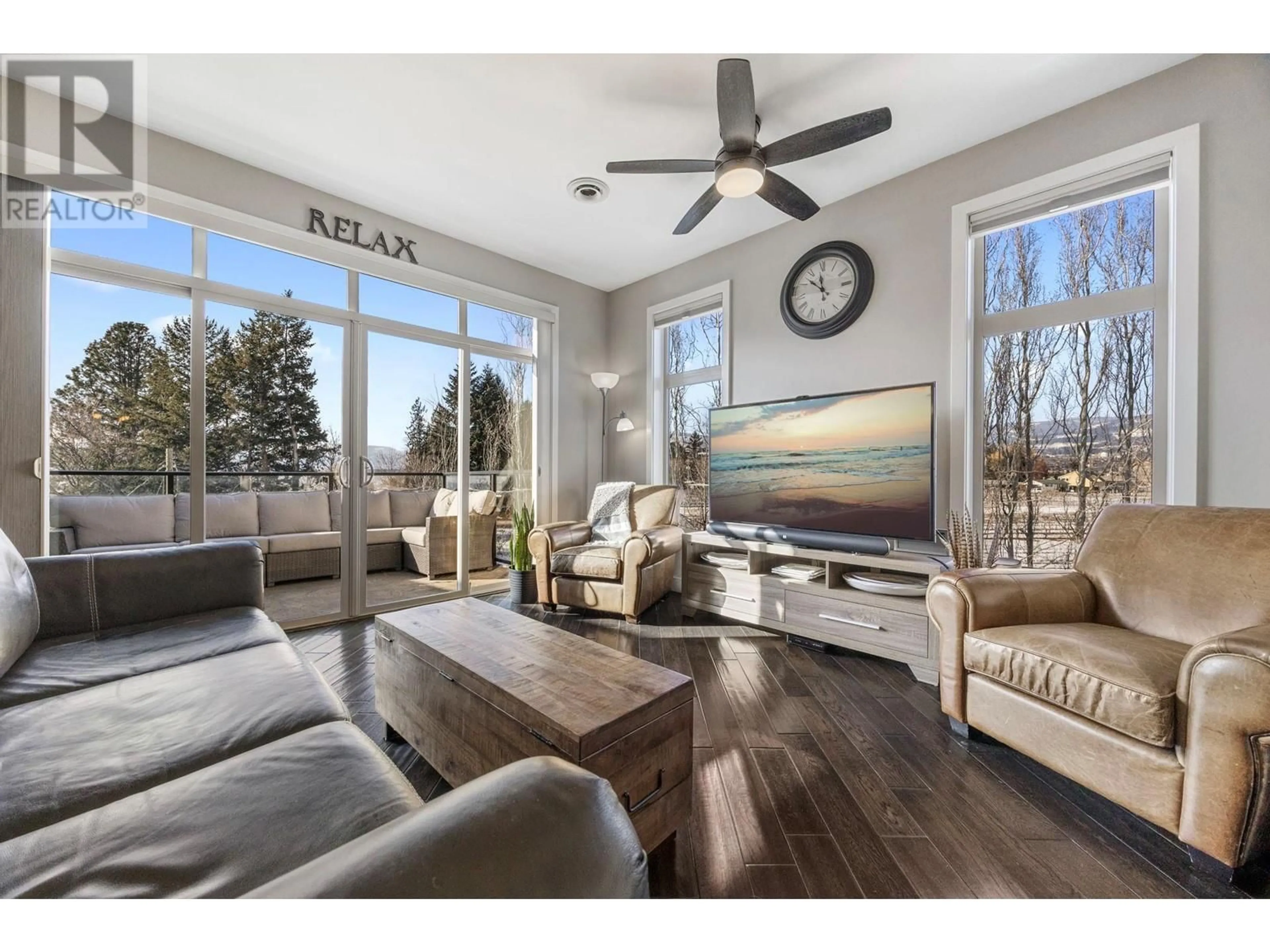 Living room with furniture, wood/laminate floor for 4042 Pritchard Drive NE Unit# 2303, West Kelowna British Columbia V4T3E4