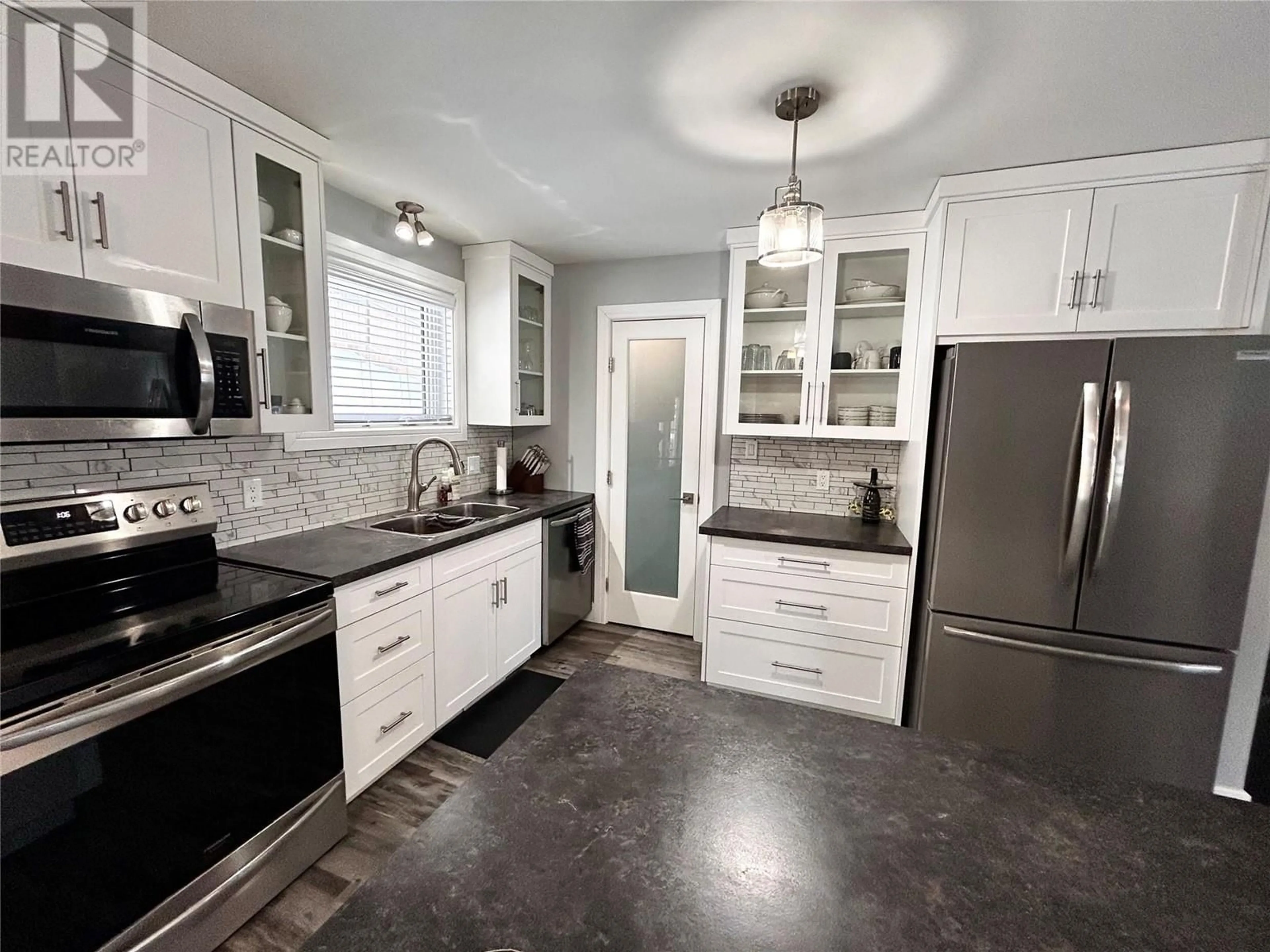 Contemporary kitchen, ceramic/tile floor for 164 Gwillim Crescent, Tumbler Ridge British Columbia V0C2W0