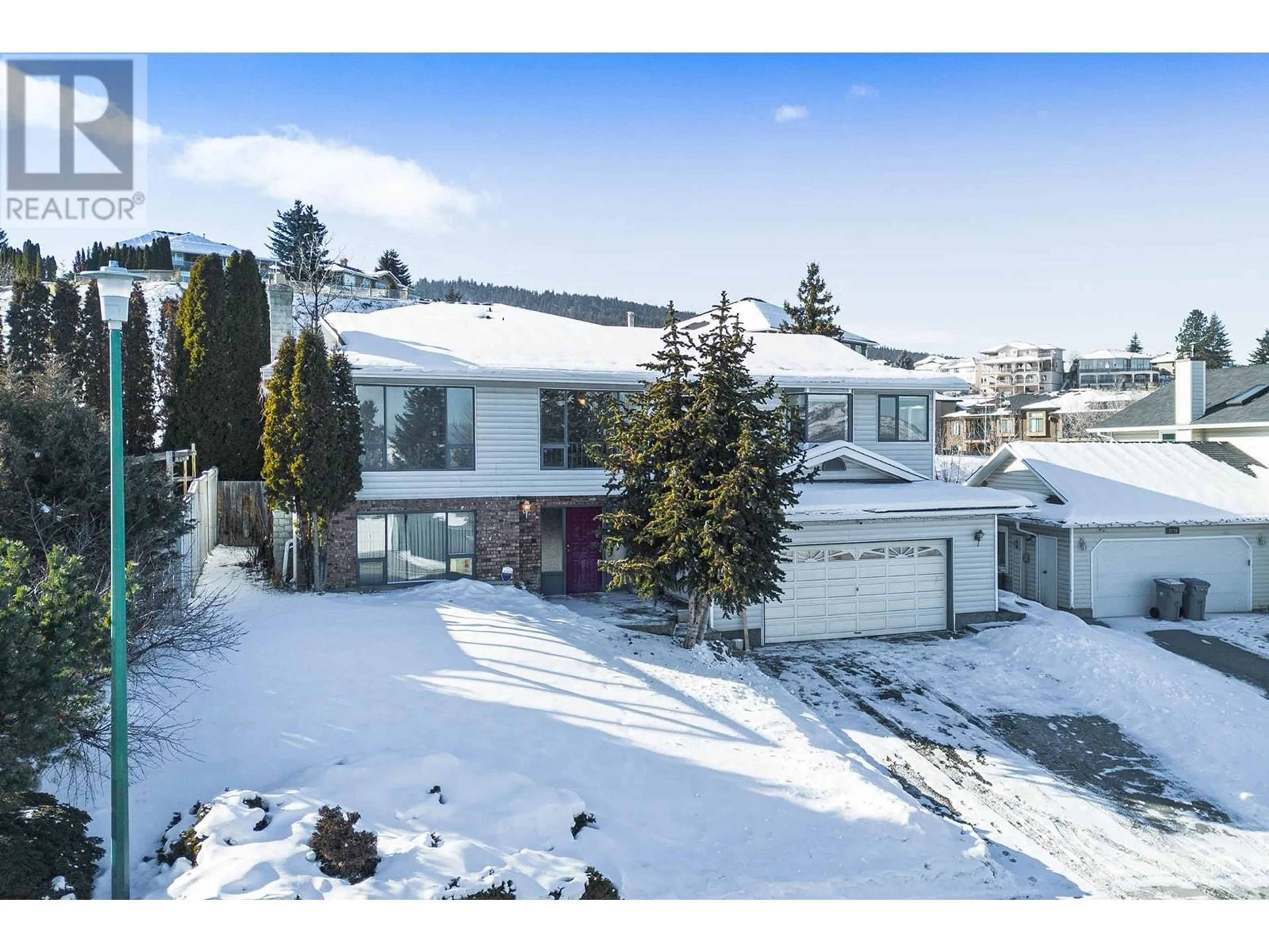 A pic from outside/outdoor area/front of a property/back of a property/a pic from drone, mountain view for 2120 GARYMEDE Drive, Kamloops British Columbia V1S1N8