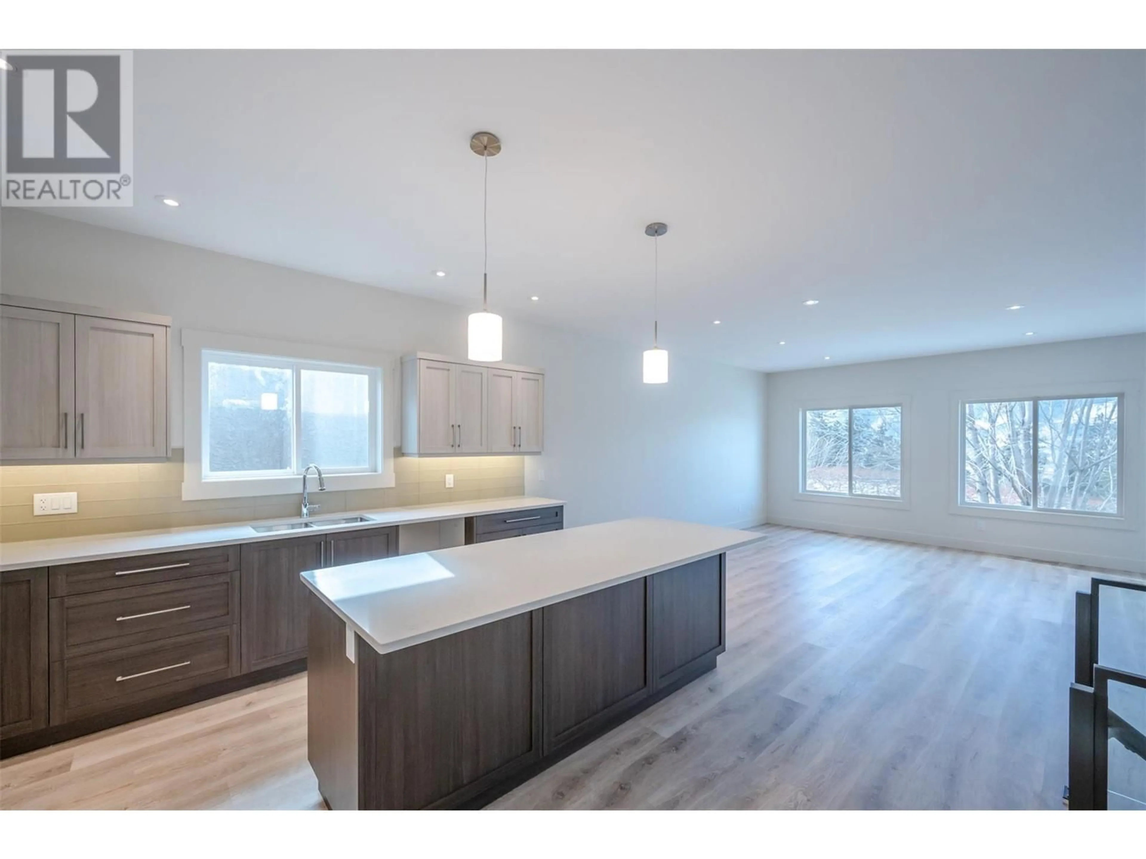 Open concept kitchen, wood/laminate floor for 695 Pineview Road Unit# 138, Penticton British Columbia V2A7S8