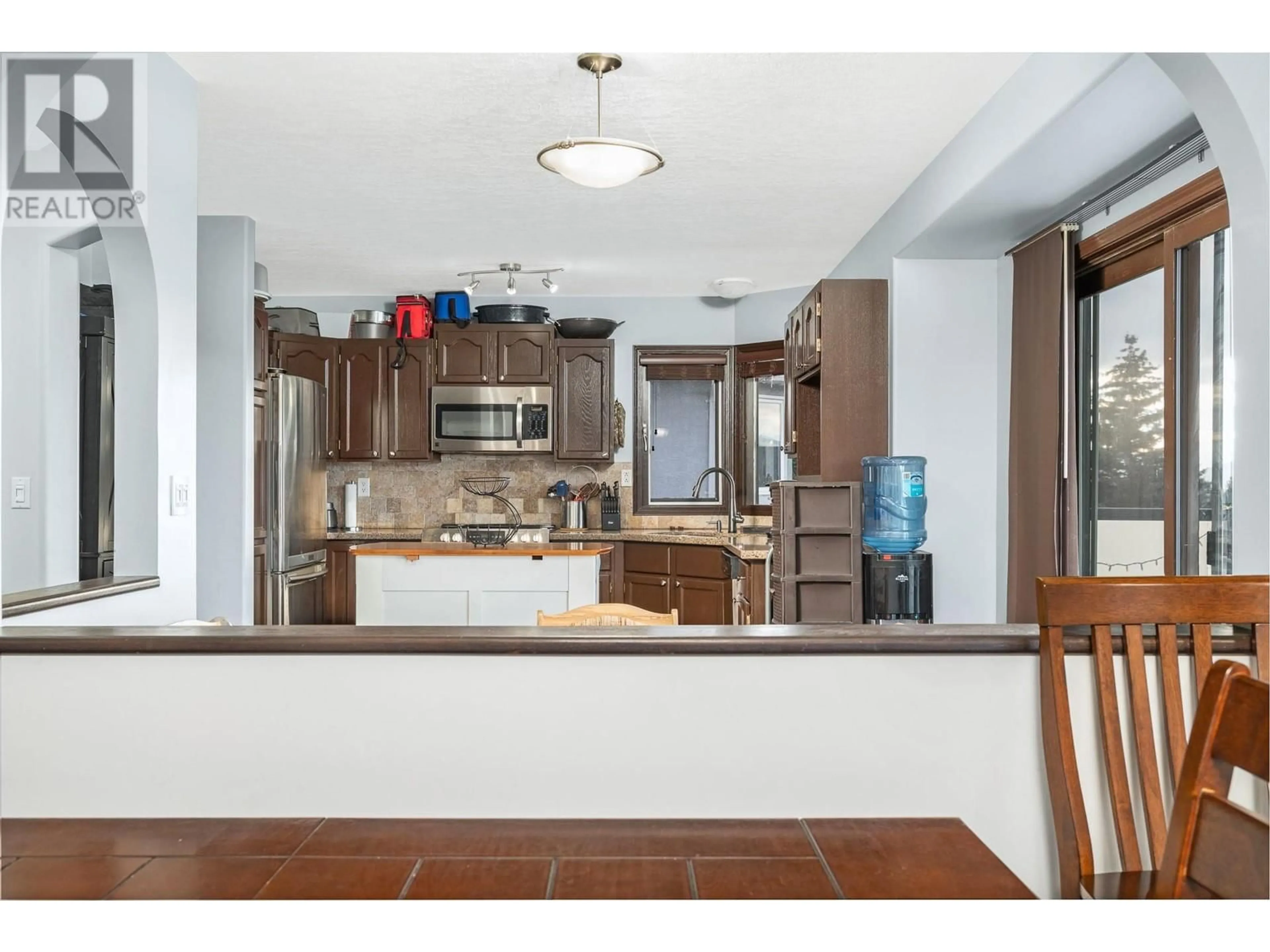 Open concept kitchen, ceramic/tile floor for 4317 Wellington Drive, Vernon British Columbia V1T9A6