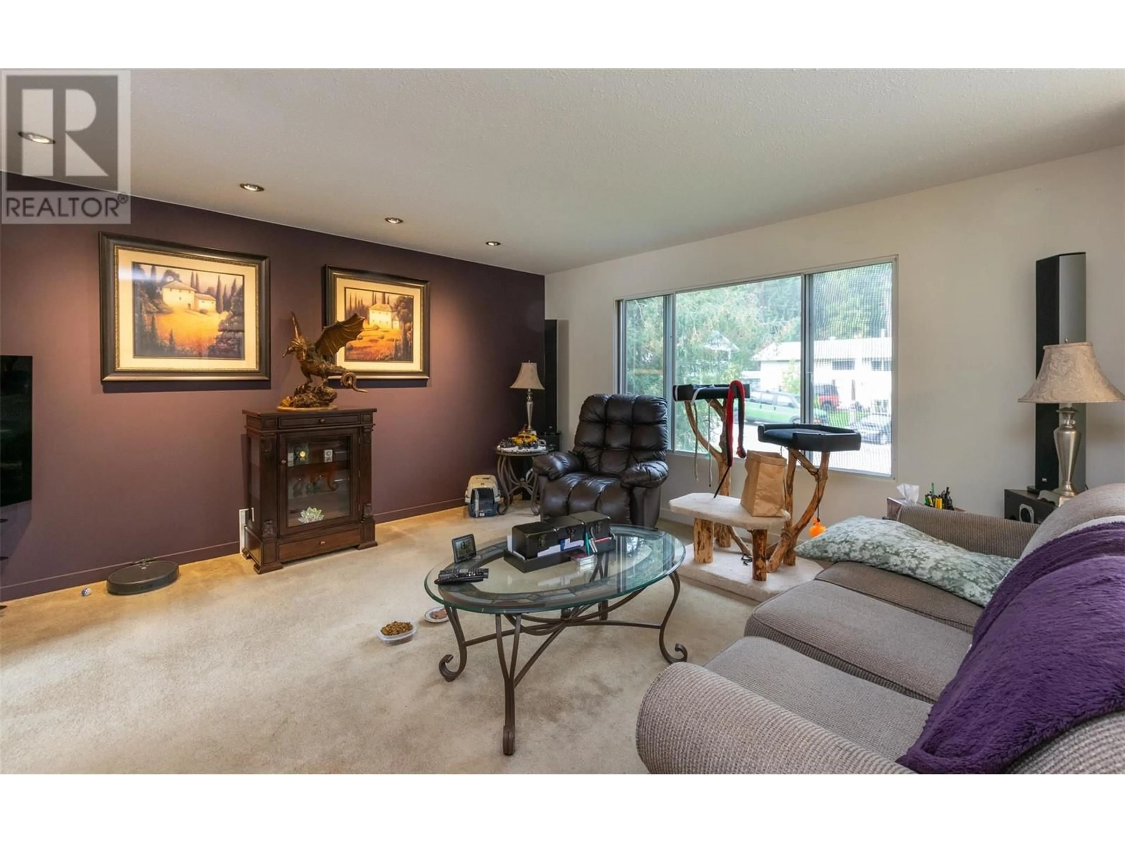 Living room with furniture, wood/laminate floor for 2270 21 Street NE, Salmon Arm British Columbia V1E3E8