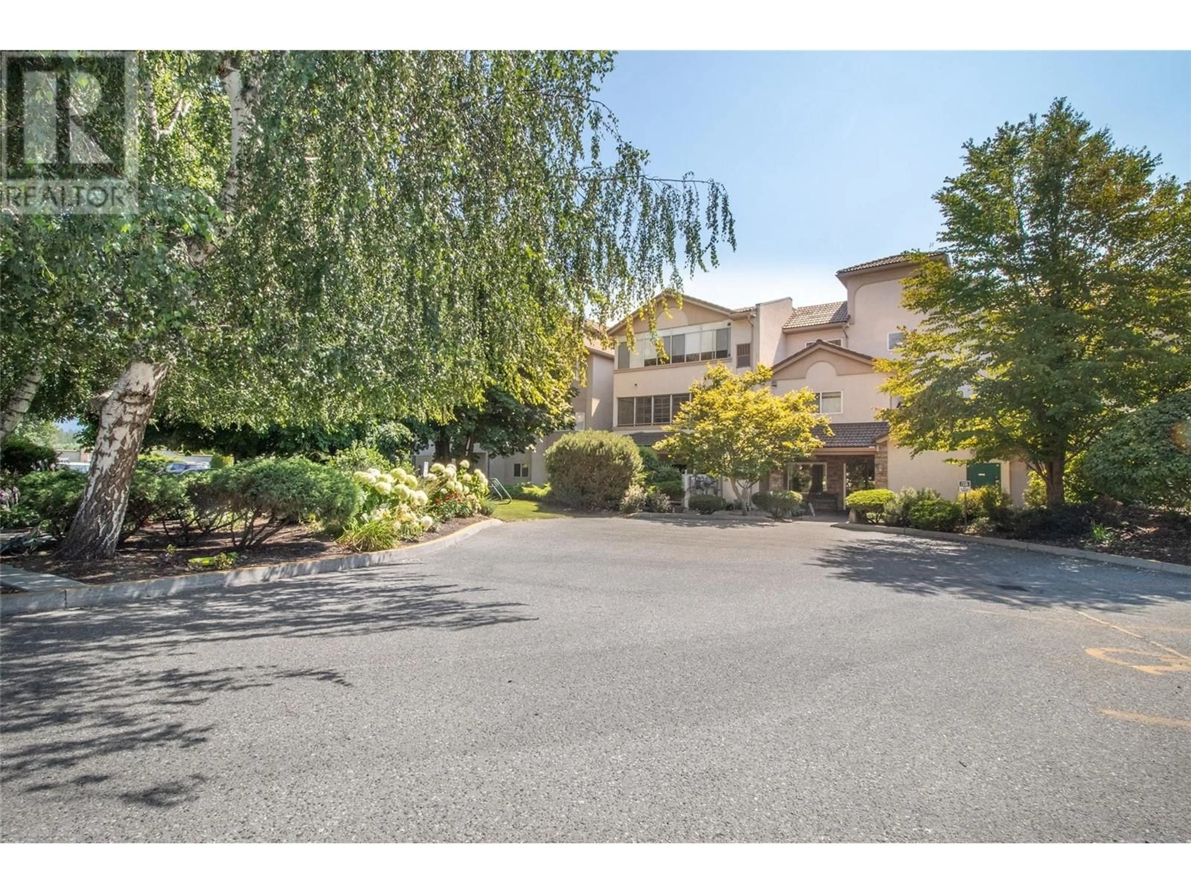 A pic from outside/outdoor area/front of a property/back of a property/a pic from drone, street for 2300 Benvoulin Road Unit# 107, Kelowna British Columbia V1W2C6