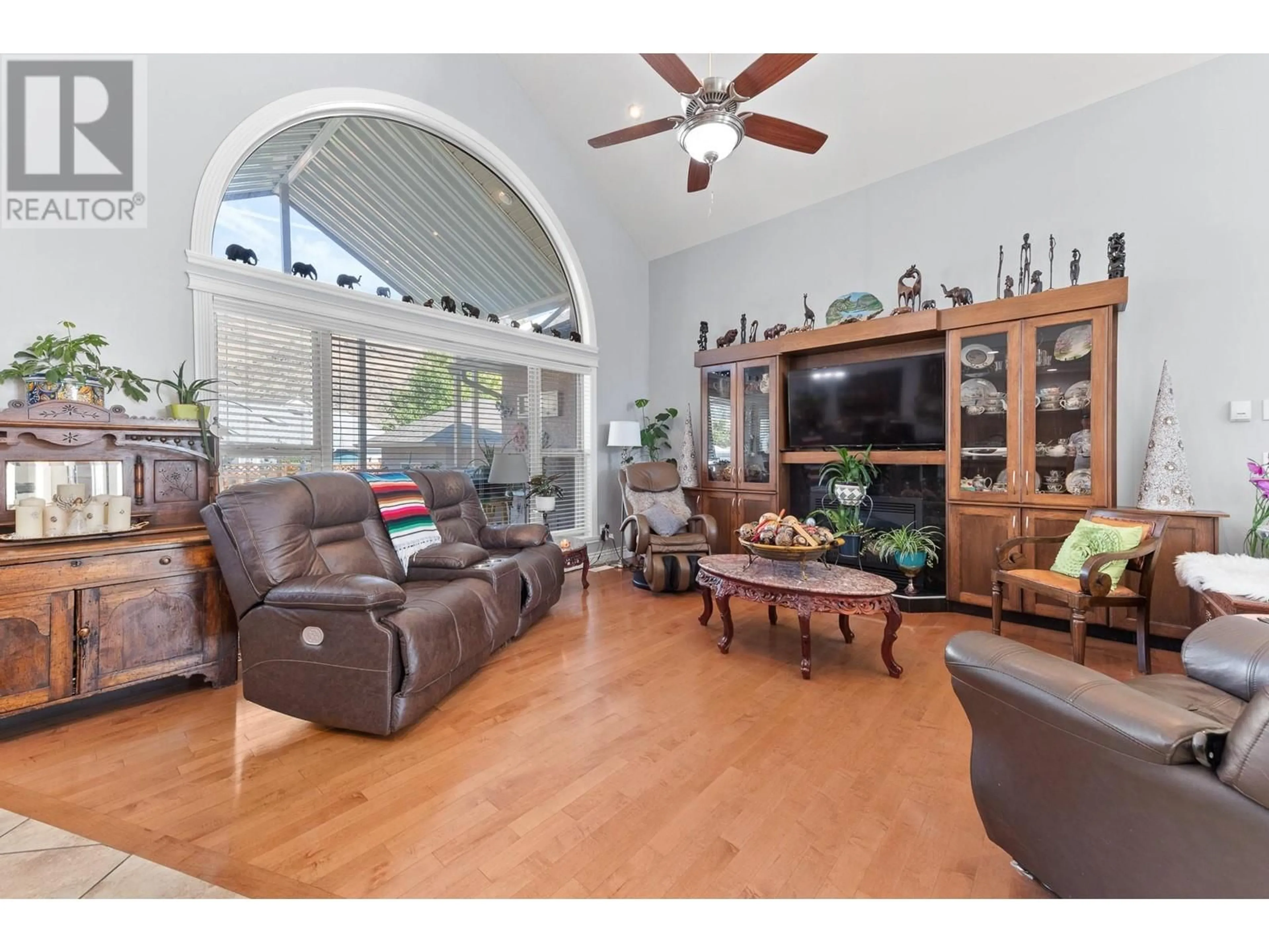 Living room with furniture, wood/laminate floor for 1124 Fairview Road, Oliver British Columbia V0H1T1