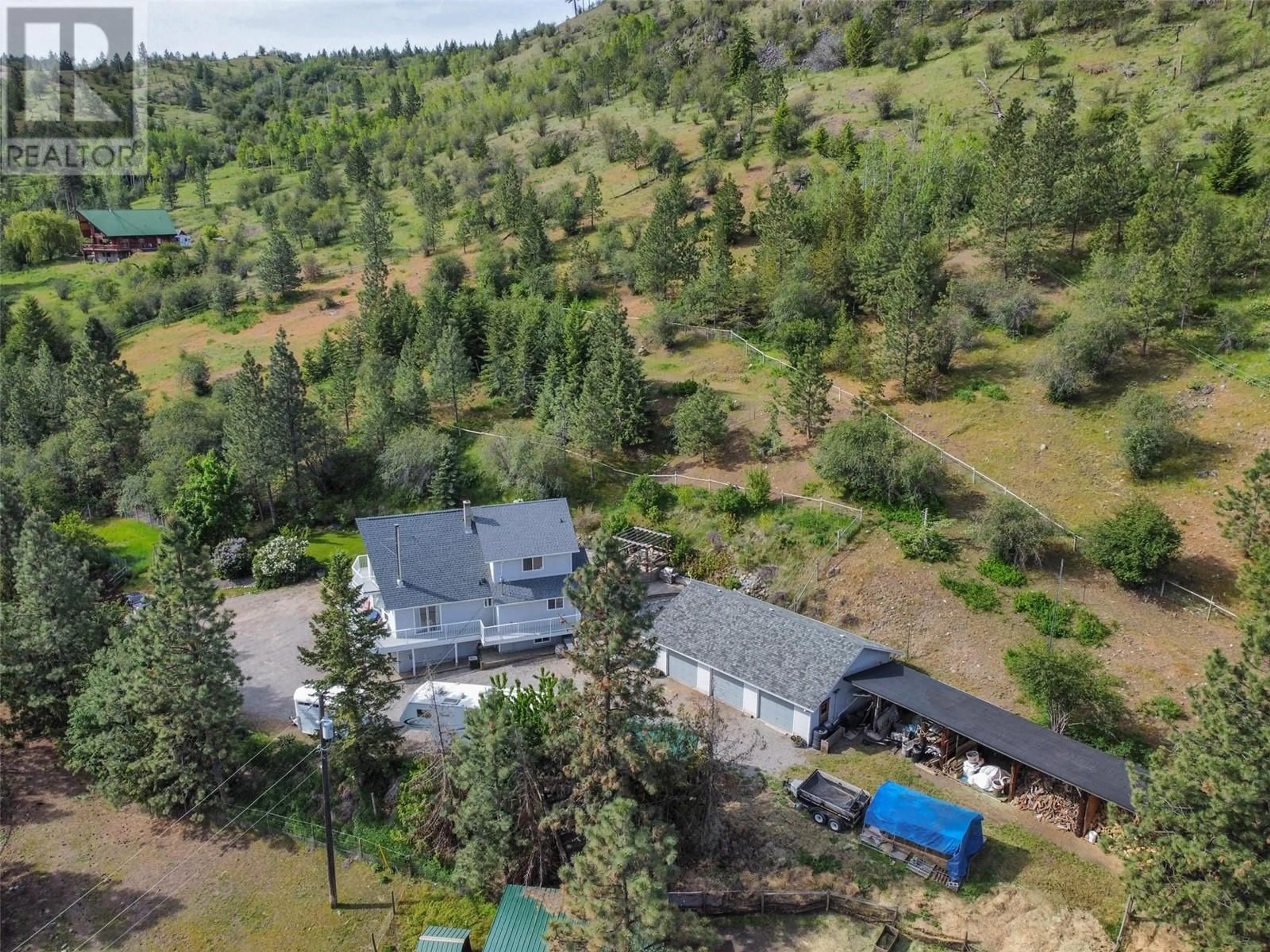 A pic from outside/outdoor area/front of a property/back of a property/a pic from drone, forest/trees view for 2737 Willowbrook Road, Oliver British Columbia V0H1T5