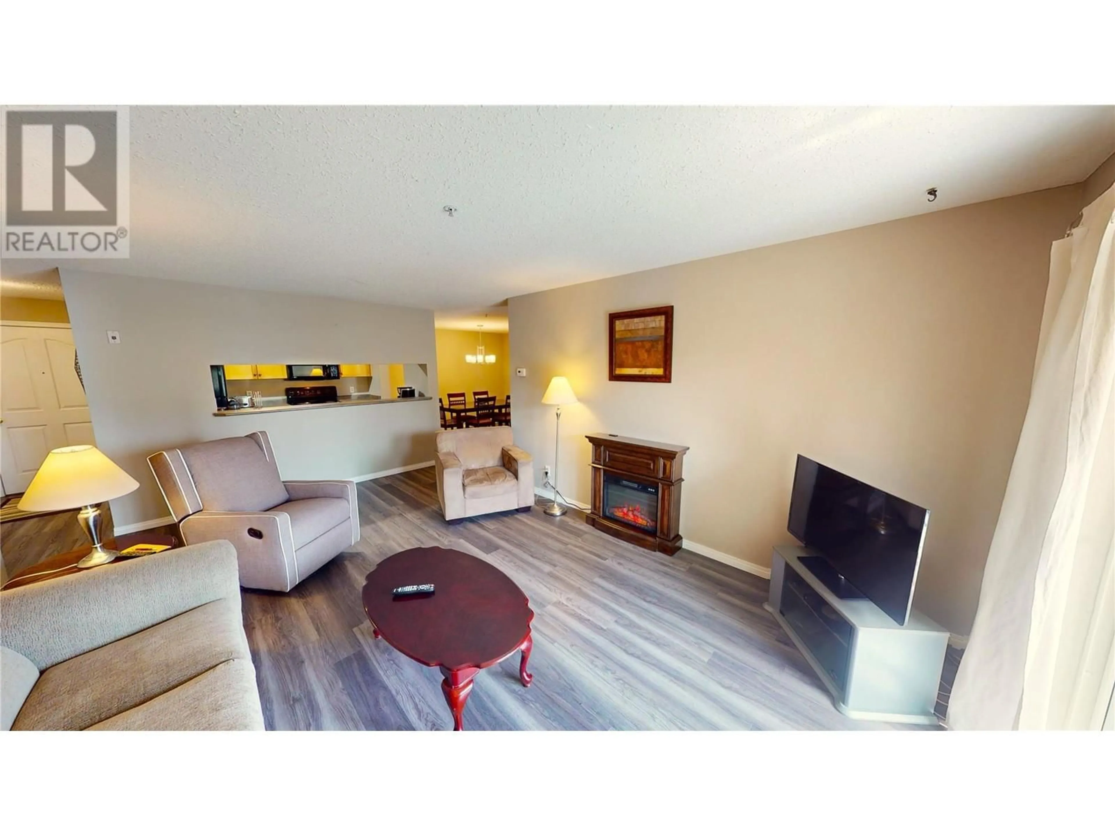 Living room with furniture, wood/laminate floor for 4769 FORSTERS LANDING Road Unit# 209, Radium Hot Springs British Columbia V0A1M0