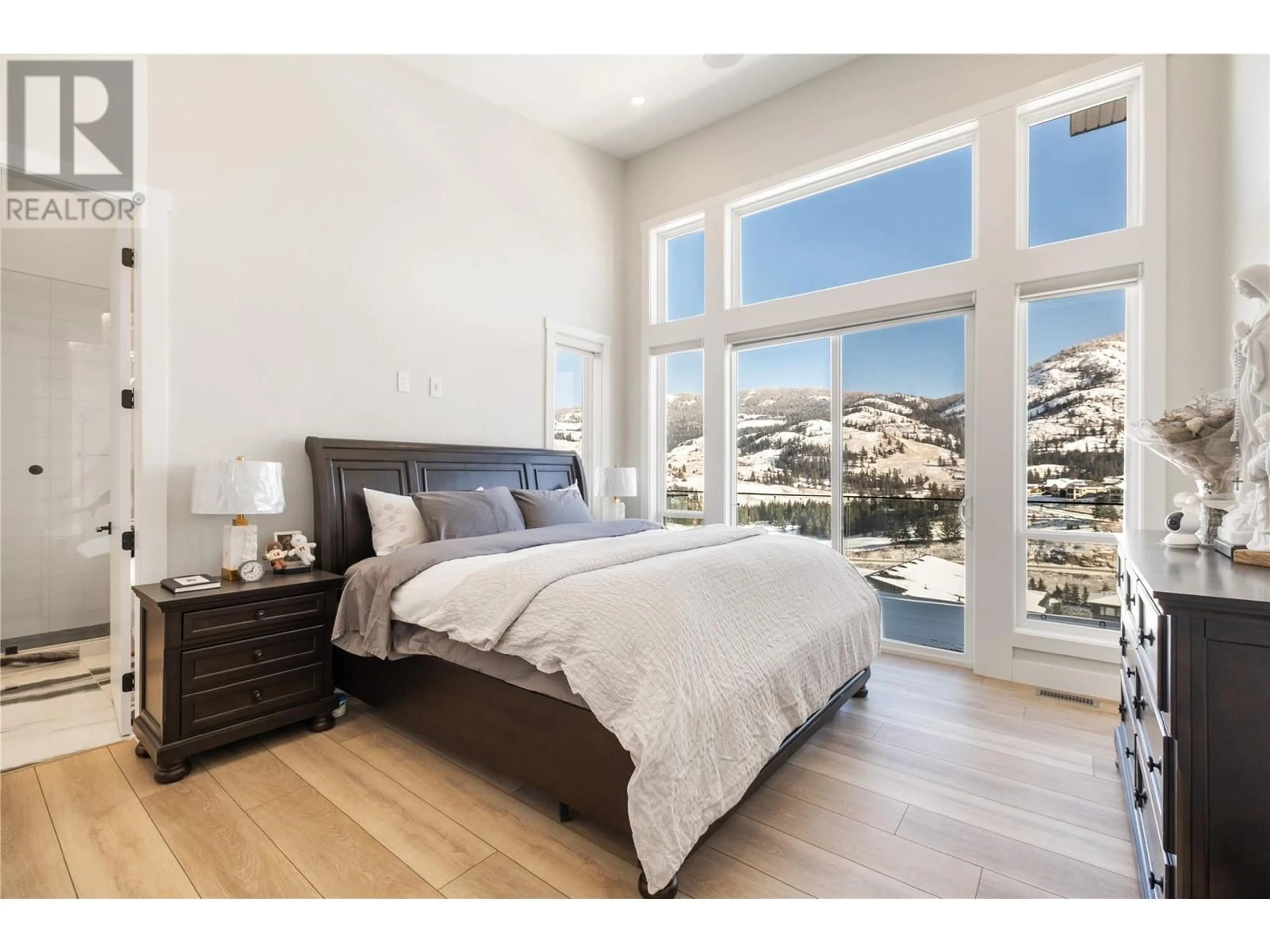 Bedroom with bed, wood/laminate floor for 869 CARNOUSTIE DRIVE, Kelowna British Columbia V1P0A3
