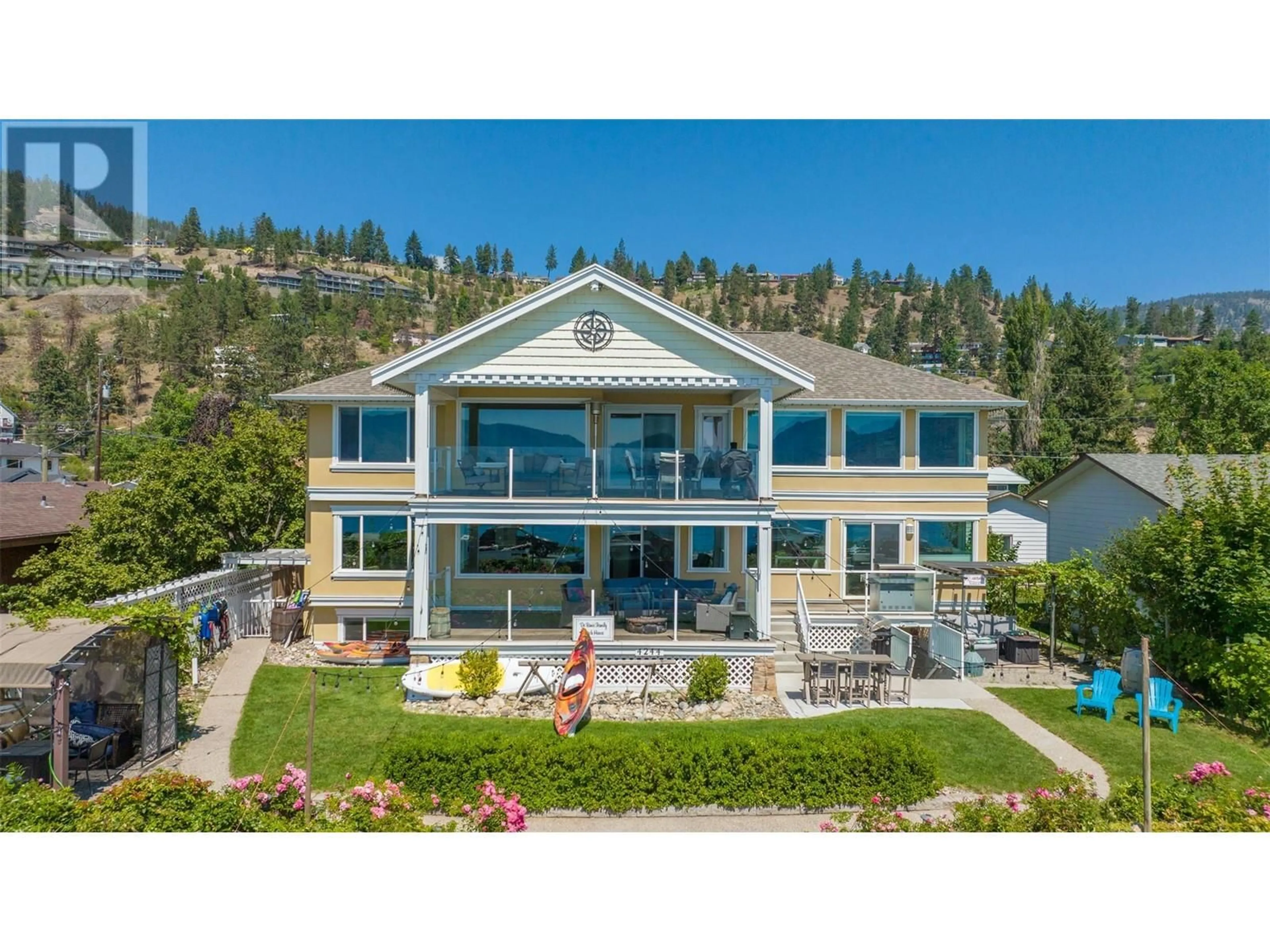 A pic from outside/outdoor area/front of a property/back of a property/a pic from drone, water/lake/river/ocean view for 4244 Beach Avenue, Peachland British Columbia V0H1X6