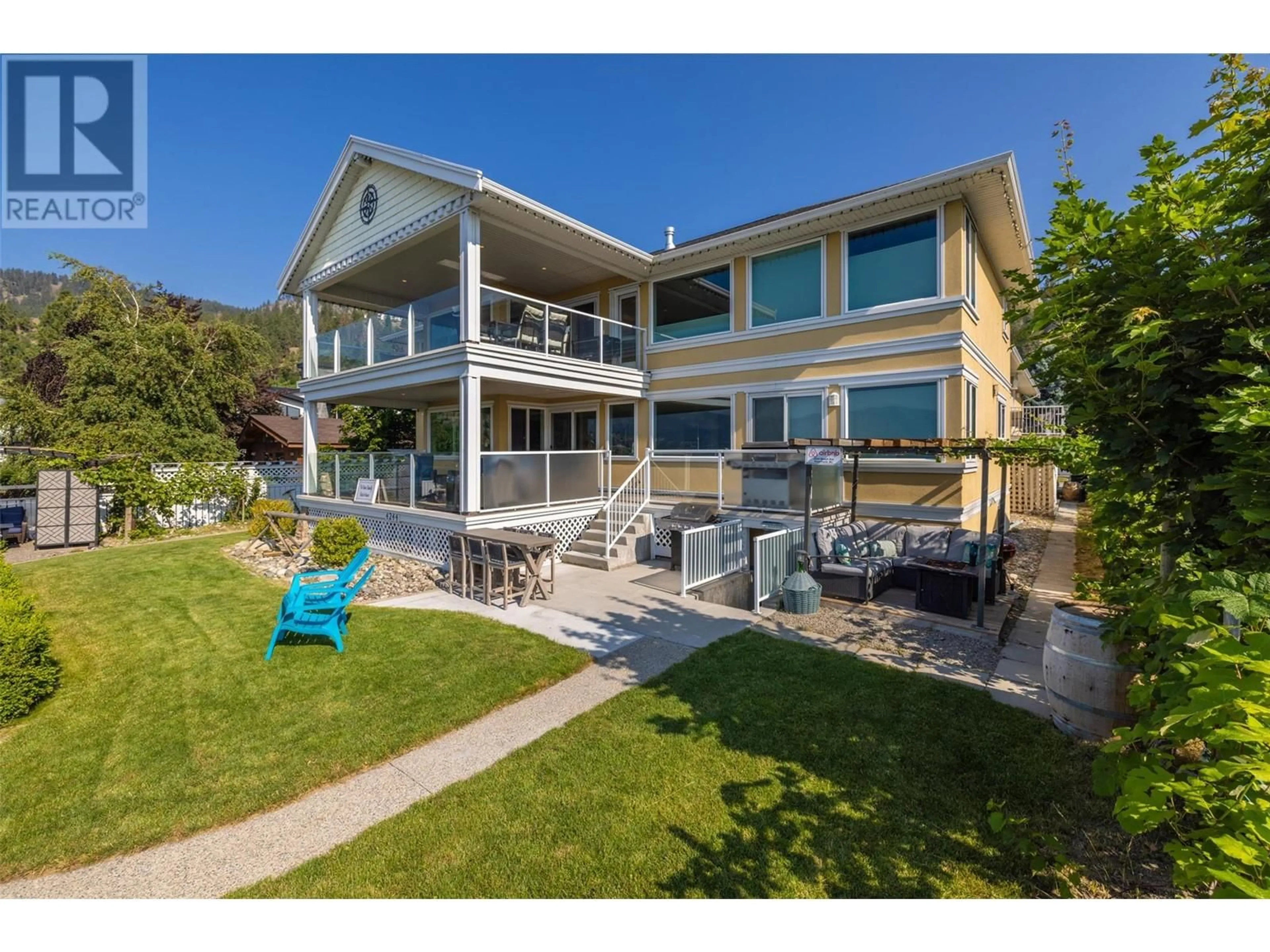 A pic from outside/outdoor area/front of a property/back of a property/a pic from drone, water/lake/river/ocean view for 4244 Beach Avenue, Peachland British Columbia V0H1X6