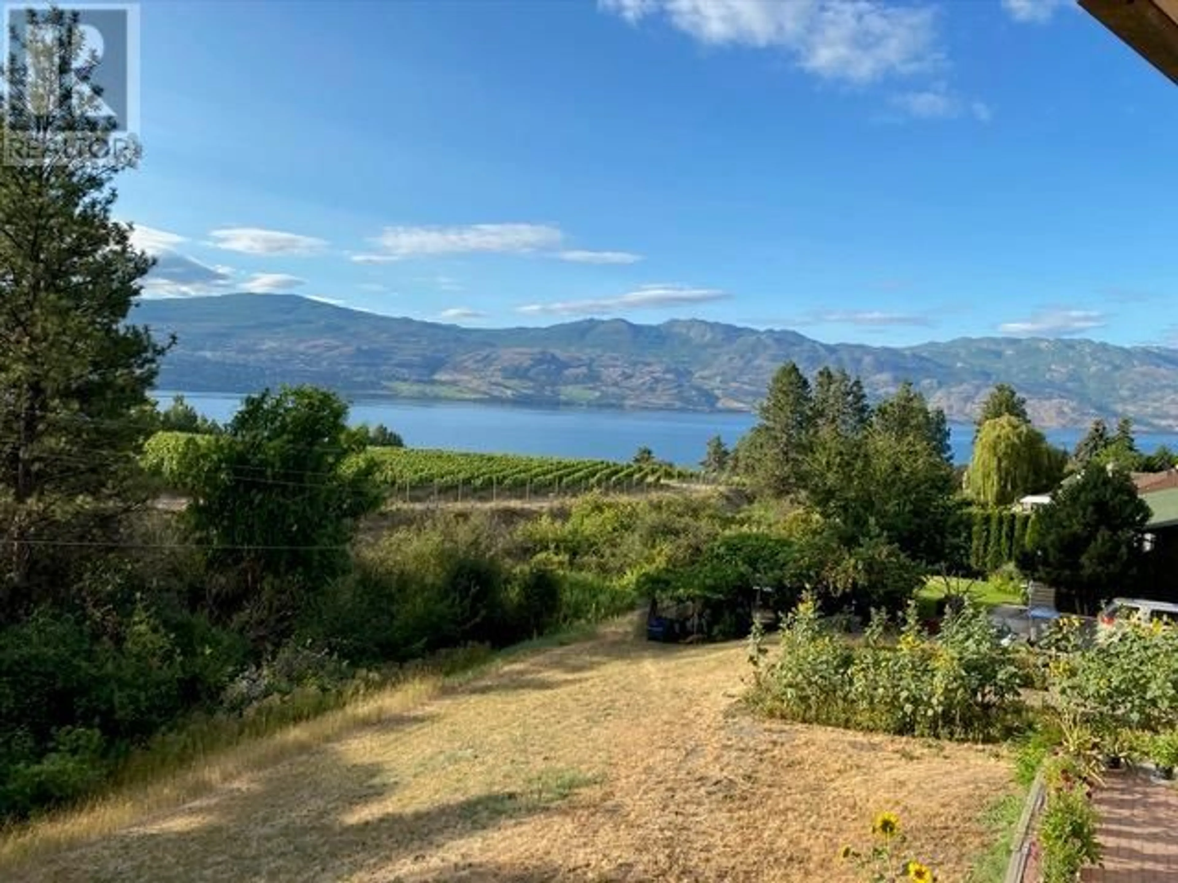 A pic from outside/outdoor area/front of a property/back of a property/a pic from drone, water/lake/river/ocean view for 1049 KELLY DRIVE, West Kelowna British Columbia V1Z2T1