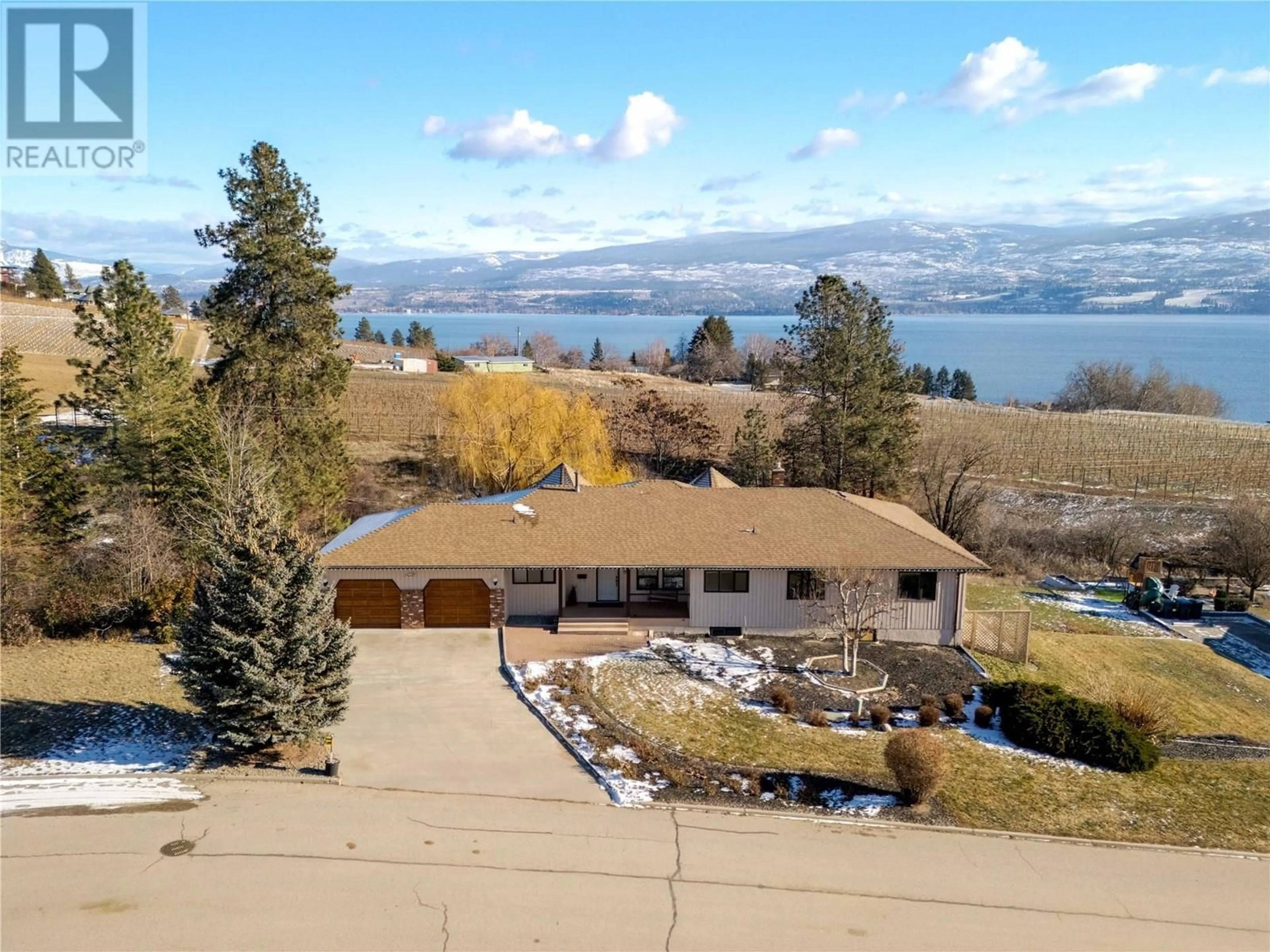 A pic from outside/outdoor area/front of a property/back of a property/a pic from drone, water/lake/river/ocean view for 1049 Kelly Drive, West Kelowna British Columbia V1Z2T1