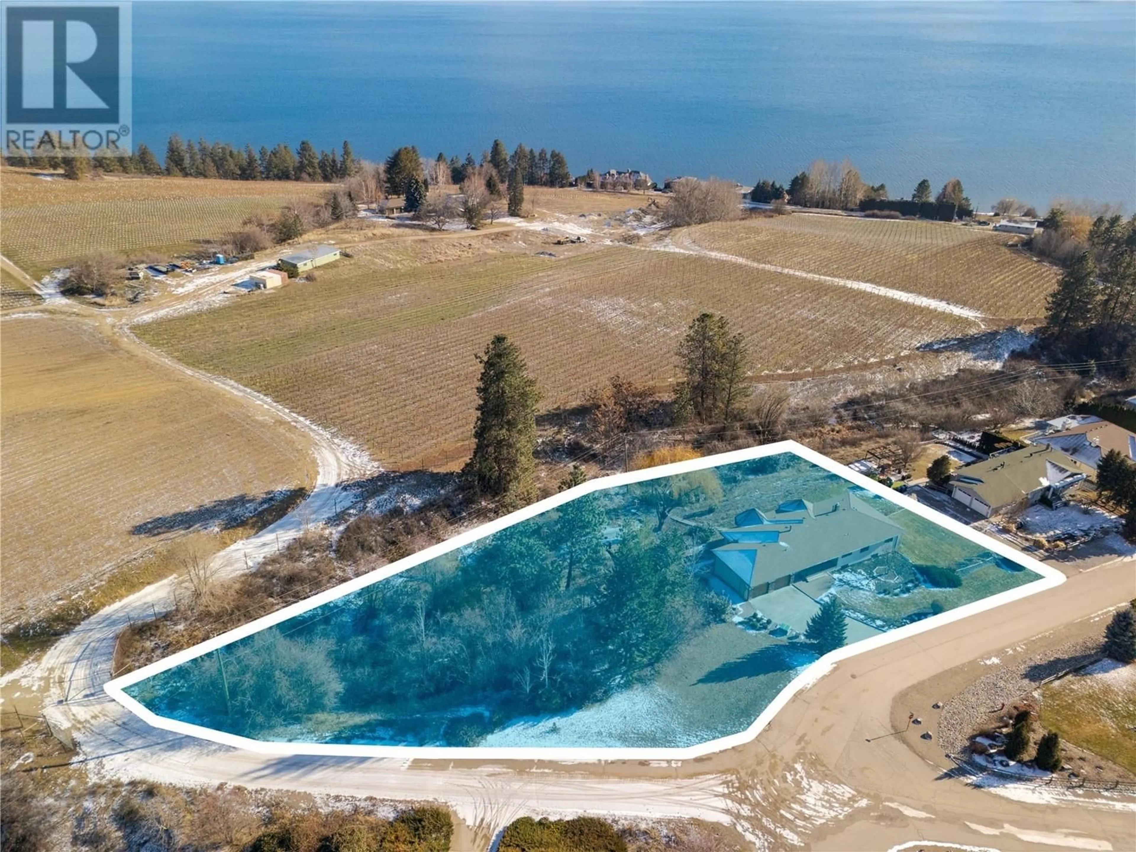 A pic from outside/outdoor area/front of a property/back of a property/a pic from drone, water/lake/river/ocean view for 1049 Kelly Drive, West Kelowna British Columbia V1Z2T1